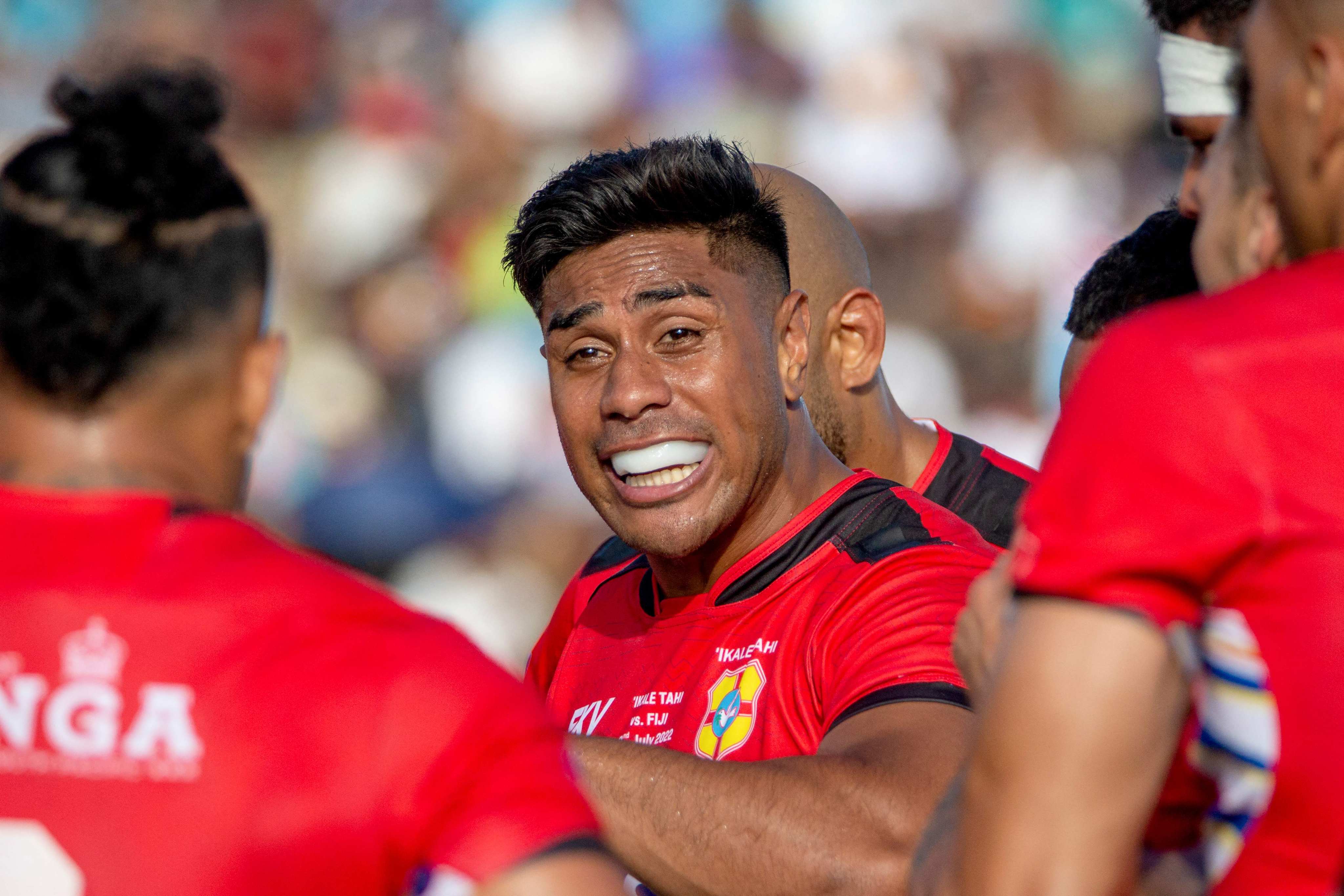 Tonga’s Malakai Fekitoa talks to teammates during his side’s World Rugby Pacific Nations Cup match against Fiji. Photo: AFP