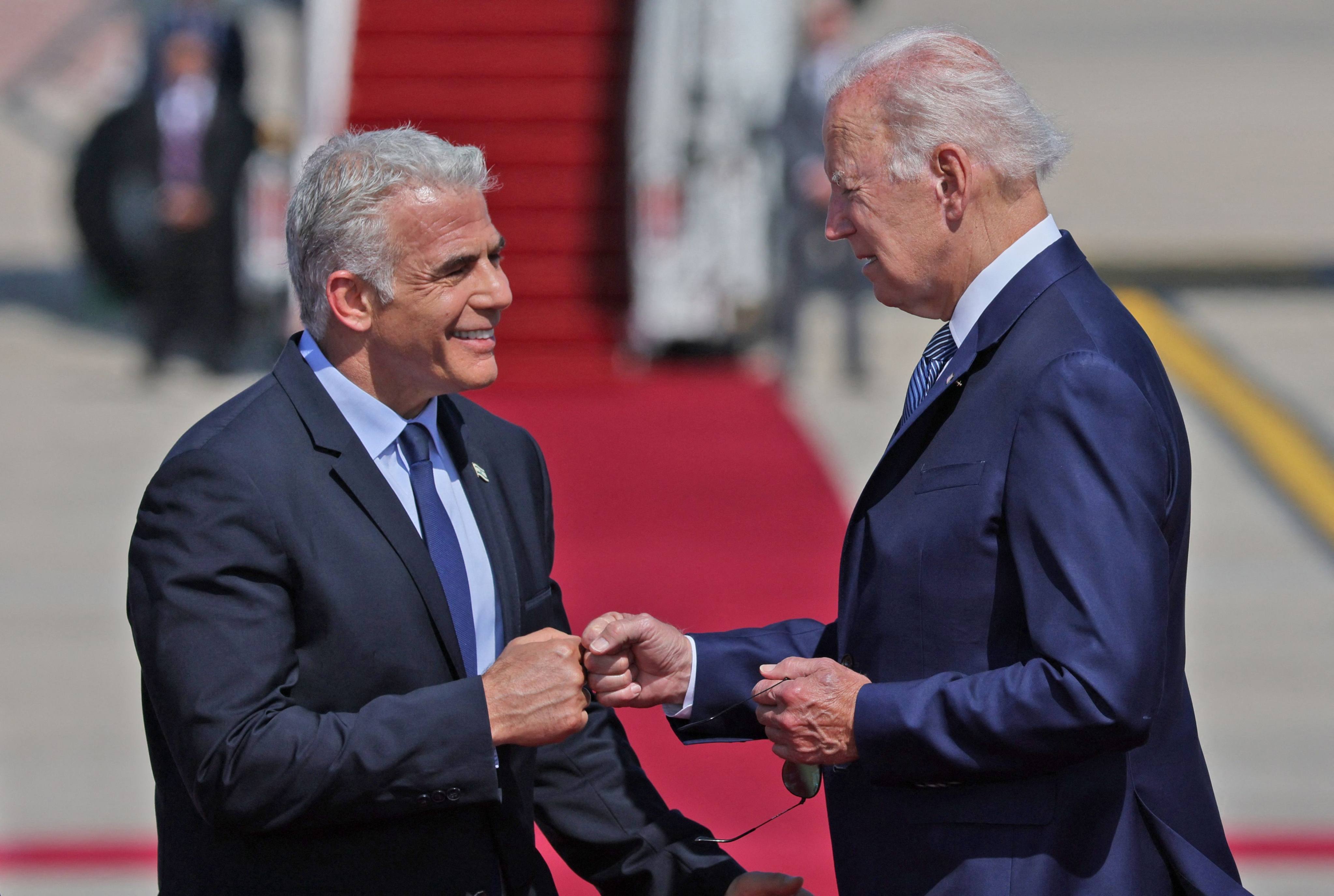 US President Joe Biden (right) bumps fists with Israel’s caretaker Prime Minister Yair Lapid following his arrival at Ben Gurion Airport in Lod near Tel Aviv on Wednesday. Photo: AFP