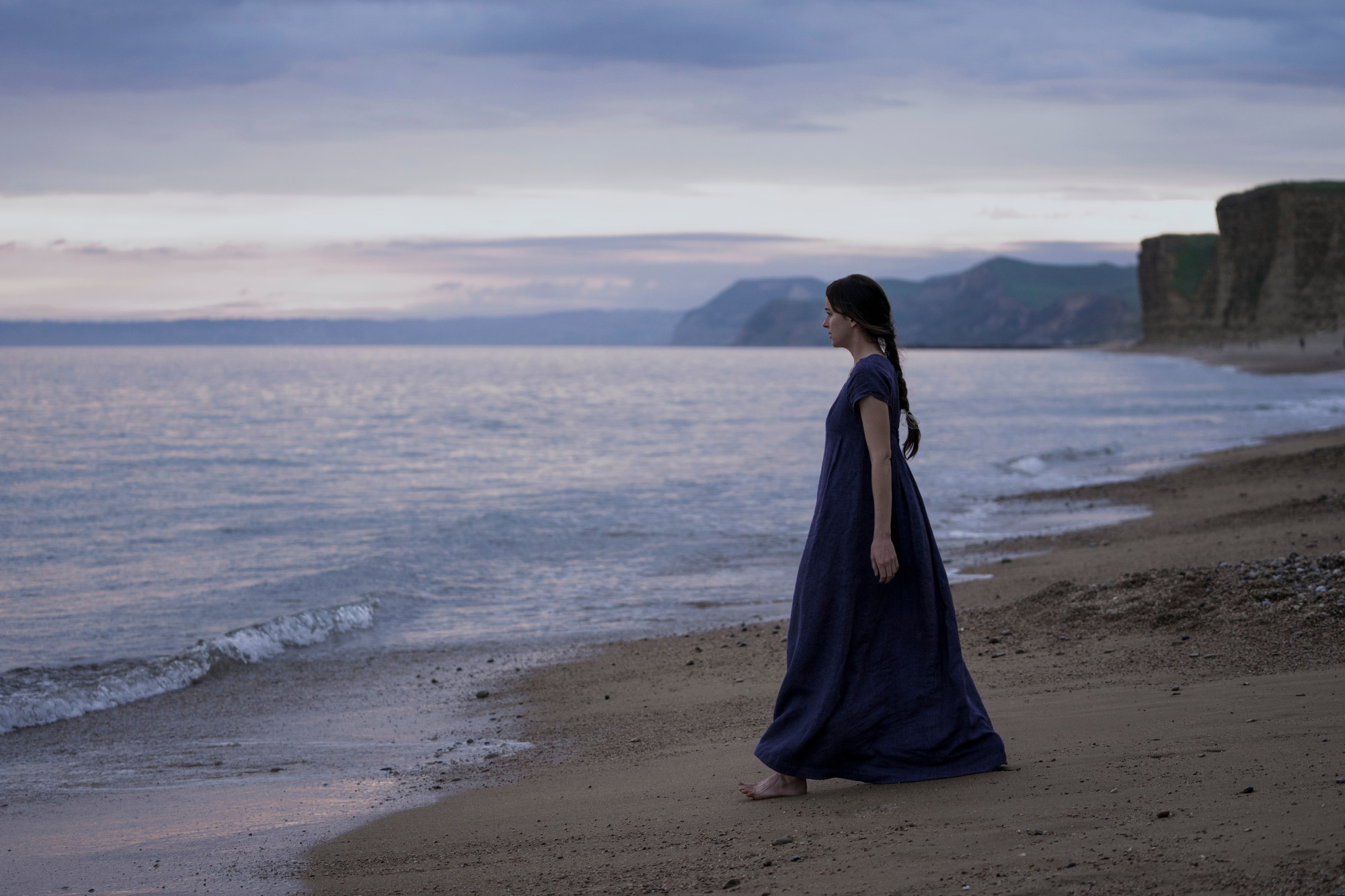 Lyme Regis Beach in a scene from Persuasion. Photo: Nick Wall / Netflix