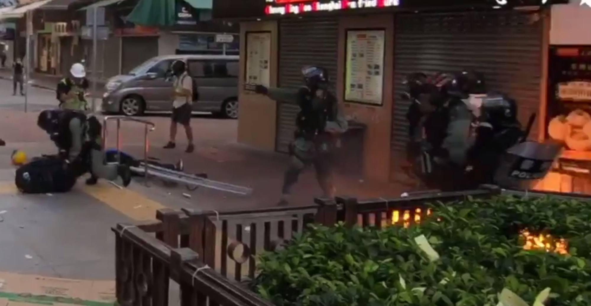 Footage from 2019 showing a violent protest in Tsuen Wan in which a police officer opens fire after his colleague is attacked. Photo: Handout