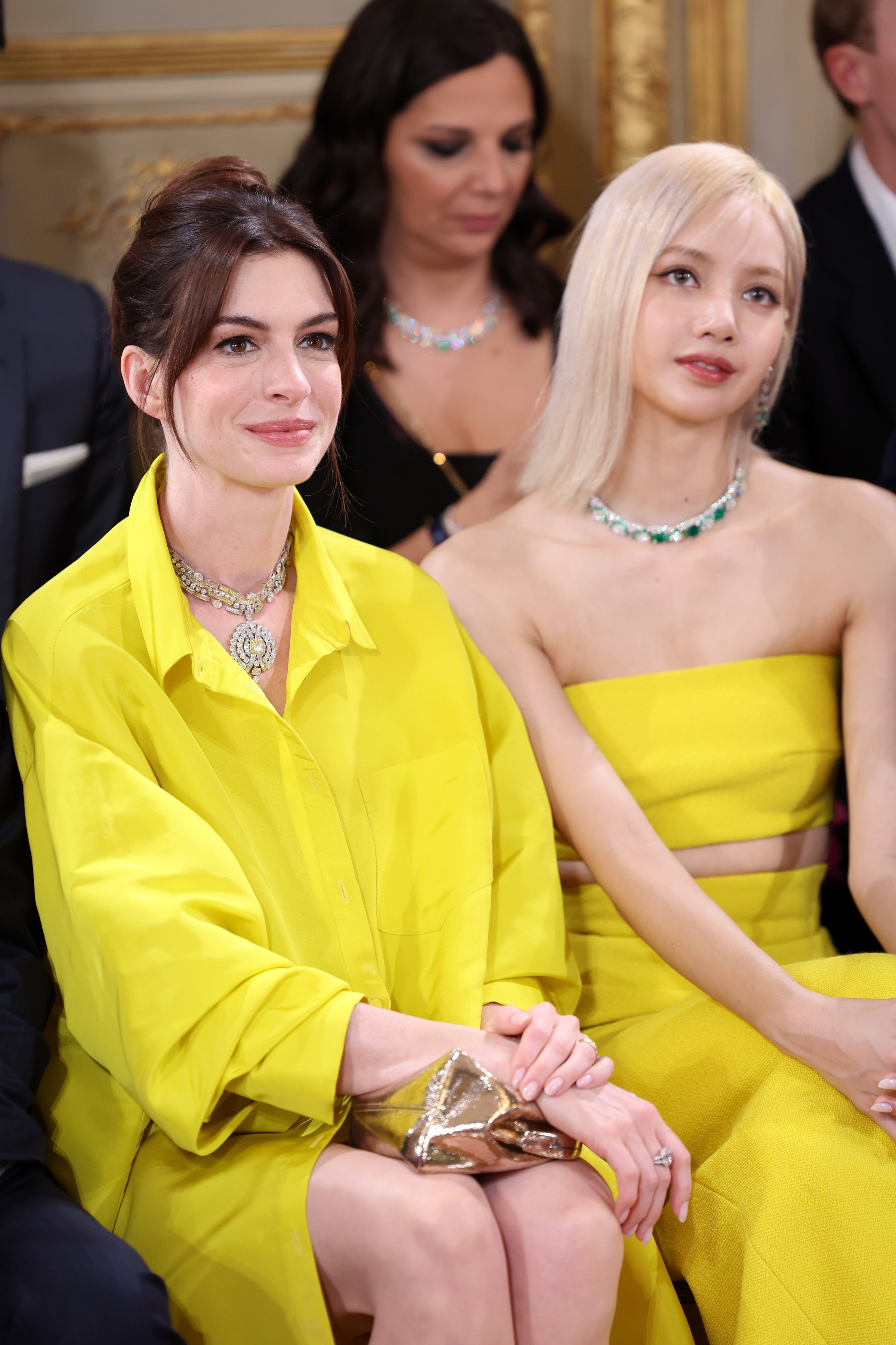 Anne Hathaway (left) and Blackpink’s Lisa, pictured at a Bulgari party in Paris in June, are among the celebrities spotted in shades of yellow this summer. Photo: Getty Images