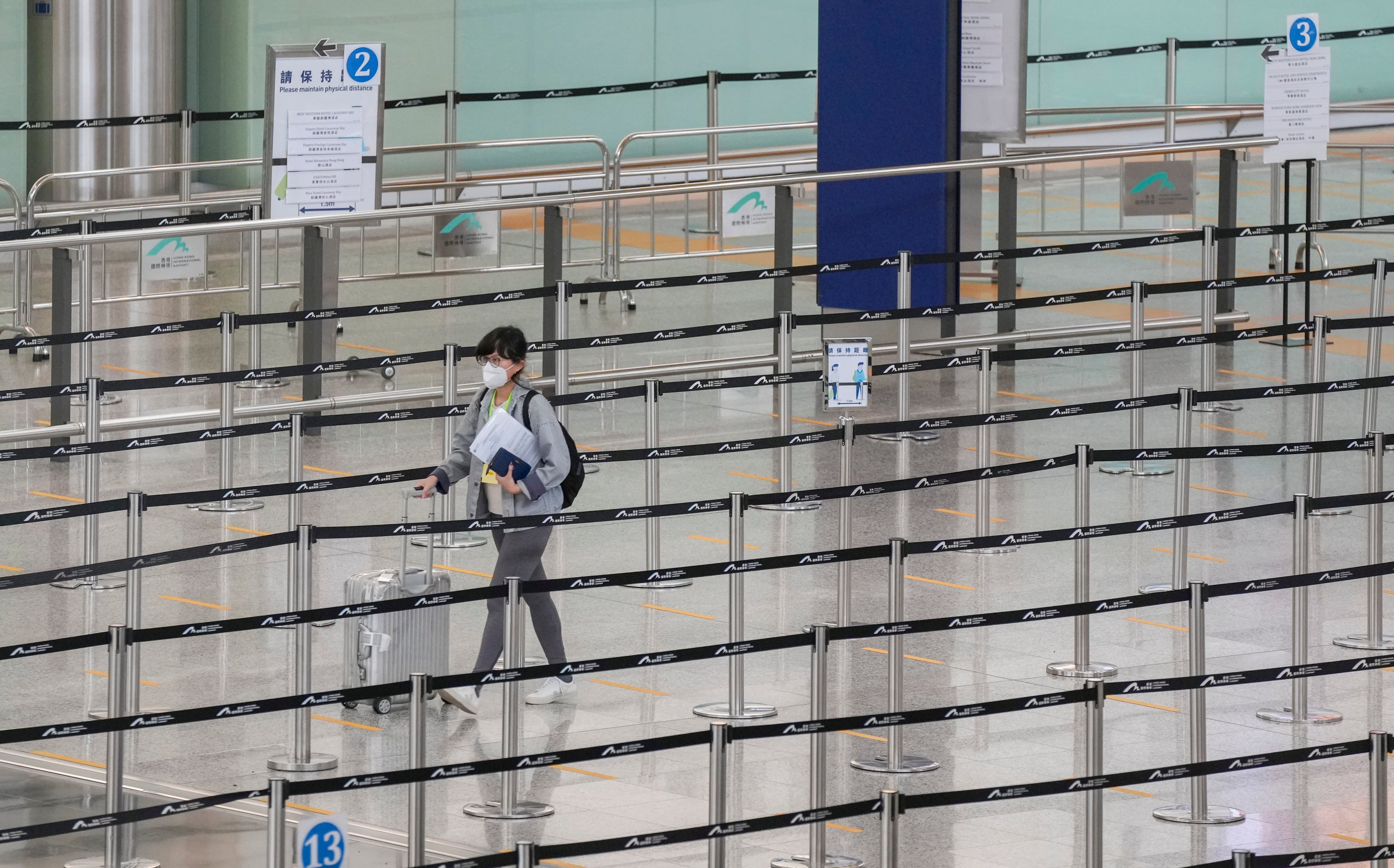 A lone traveller is seen at Hong Kong International Airport on July 7, 2022. The city’s travel restrictions have reduced the number of overseas visitors by 90 per cent since the start of the pandemic two years ago. Photo: Sam Tsang
