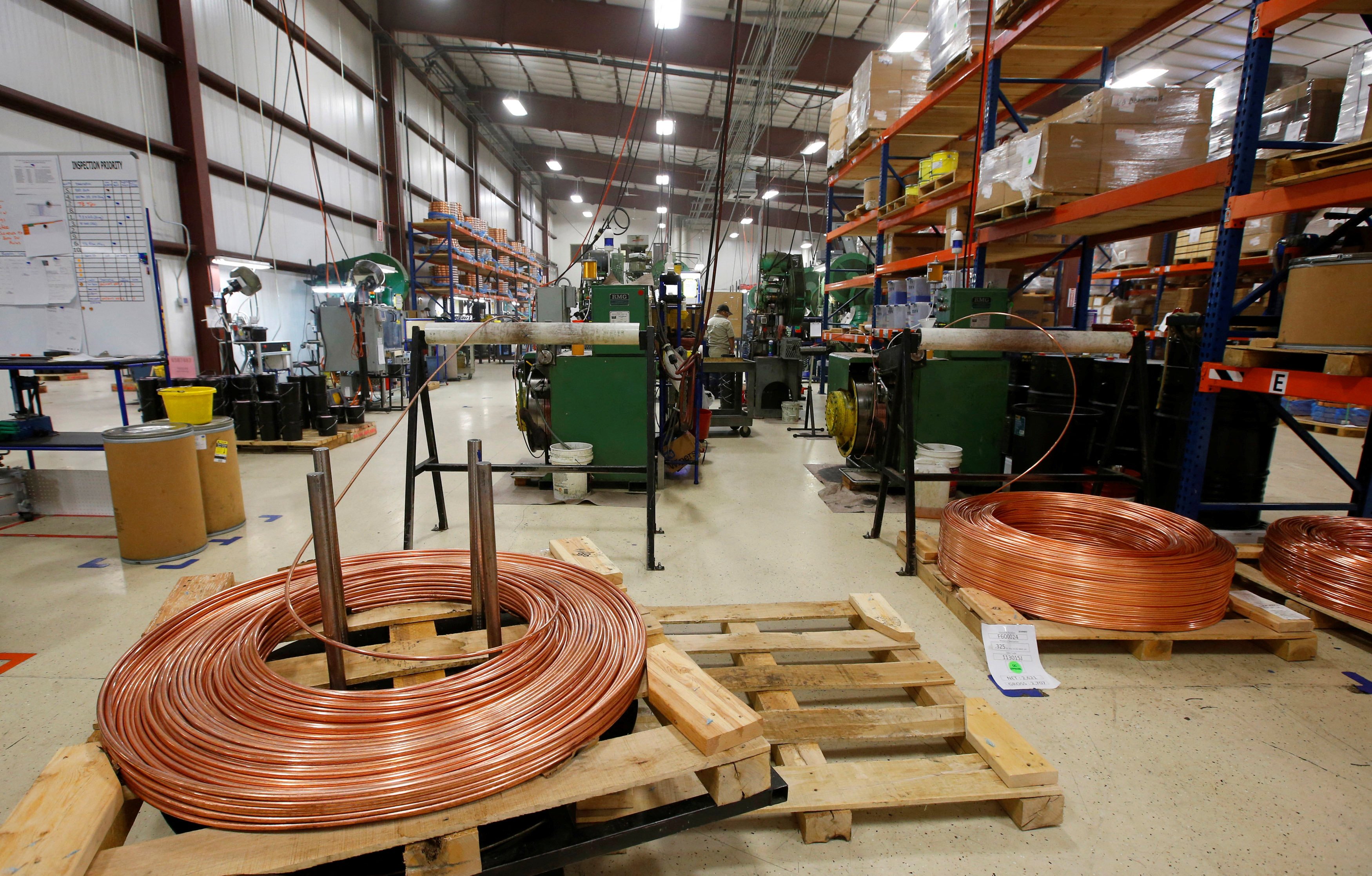 Large copper coils are cut into lengths to start the process of manufacturing a bullet at Barnes Bullets in Mona, Utah, January 6, 2016. Photo: Reuters