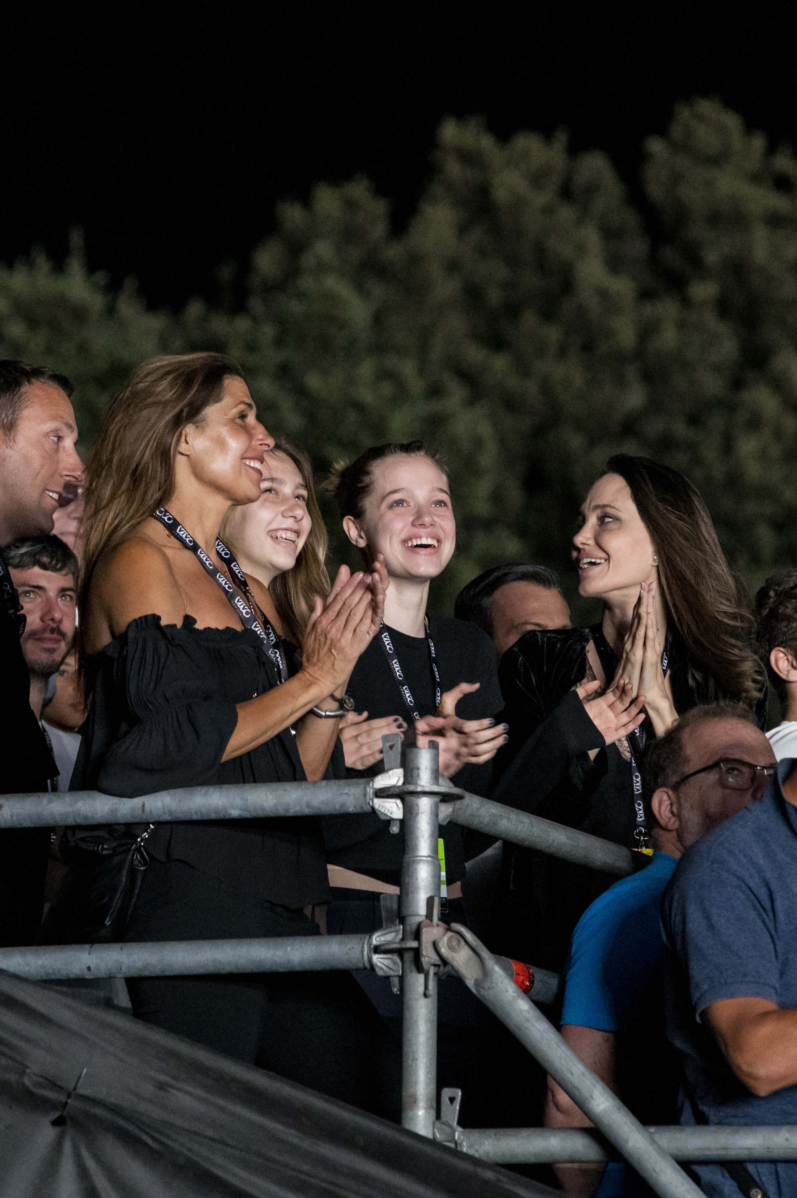 Like mother, like daughter: Angelina Jolie and daughter Shiloh Jolie-Pitt clap along to a rock concert in Italy. Photo: IPA