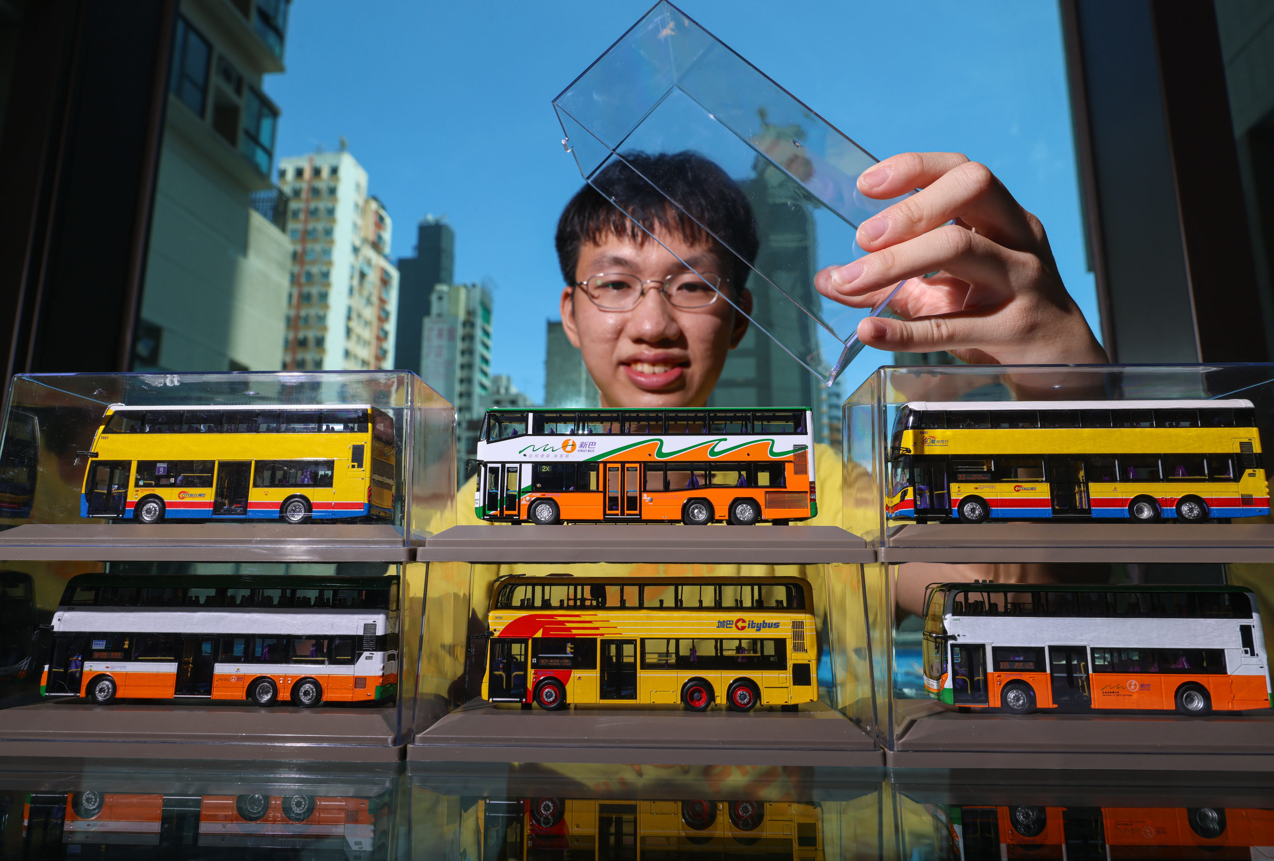 Bus enthusiast Rheneas Choi shows off his collection of miniature models. Photo: Dickson Lee