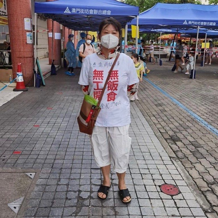 A woman in Macau wears a shirt with Chinese characters stating “no jobs, no food”, as well as messages of support for the government’s pandemic efforts. Photo: Handout