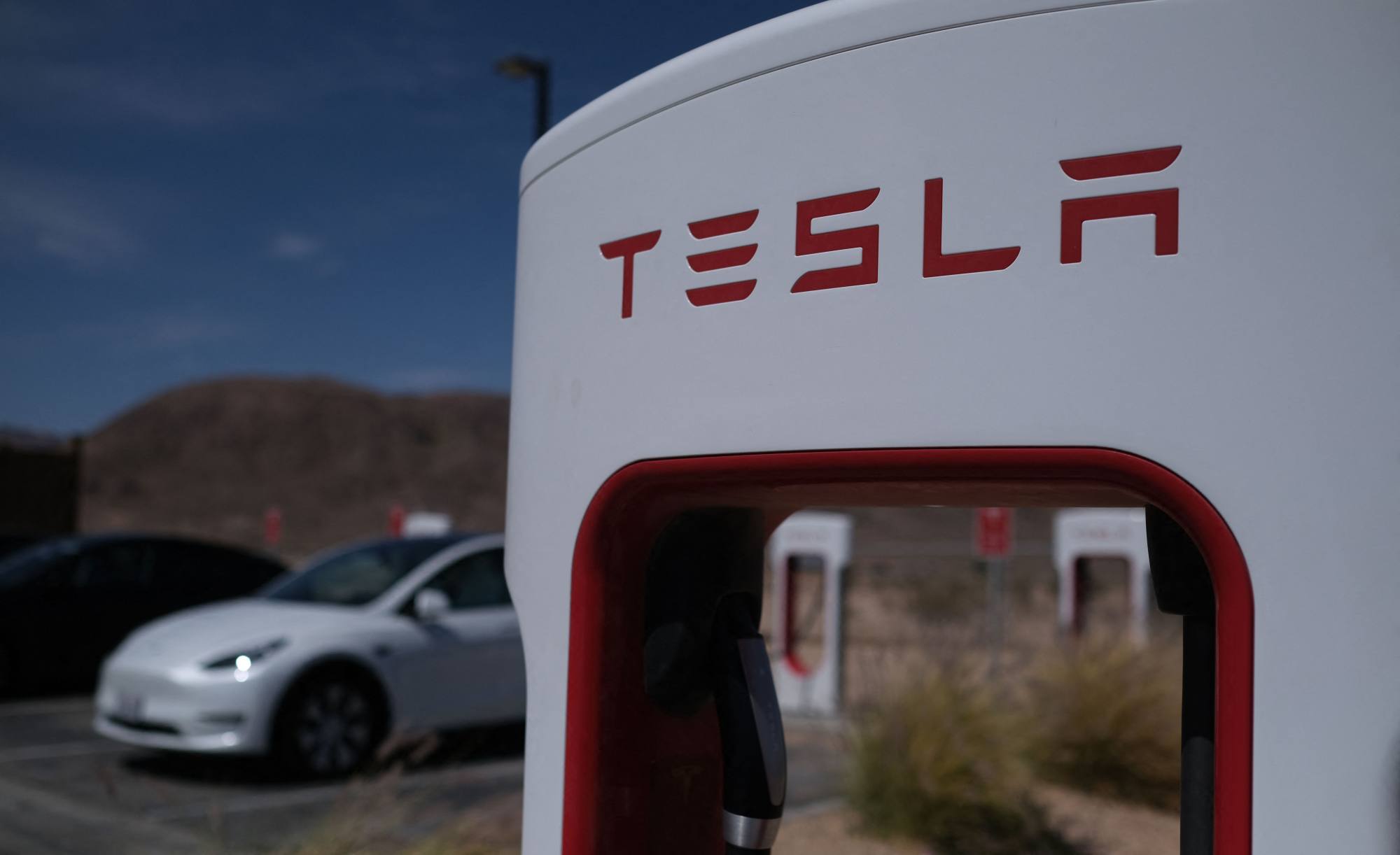In this file photo taken on May 14, 2022, Tesla cars sit at charging stations in Yermo, California. Photo: AFP