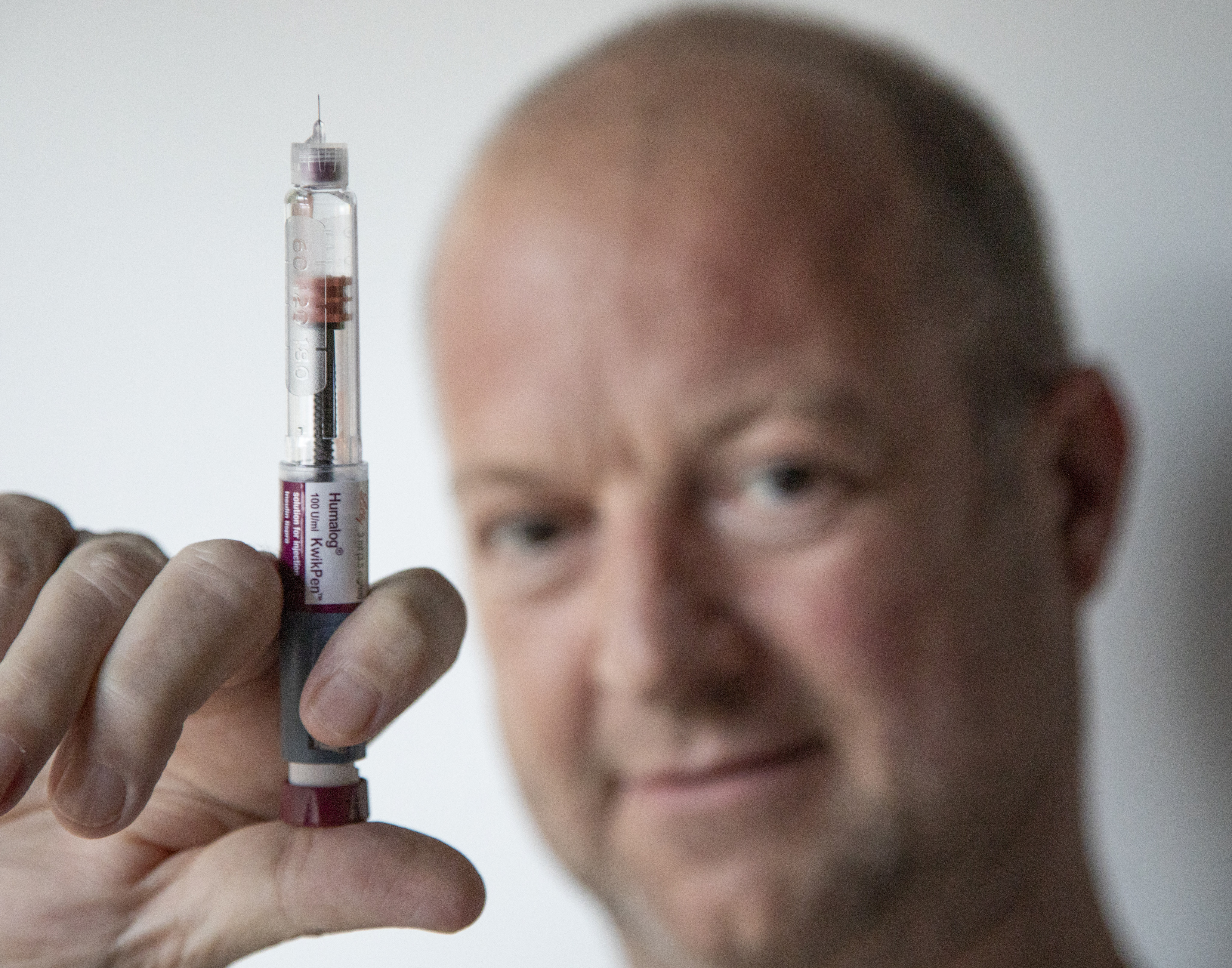 Simon O’Reilly, a production editor at the South China Morning Post, holds a Humalog KwikPen, a pre-filled fast-acting insulin pen used to treat diabetes. The type 1 diabetic recently injected four times too much of this insulin, which saw him rushed to hospital. Photo: Antony Dickson