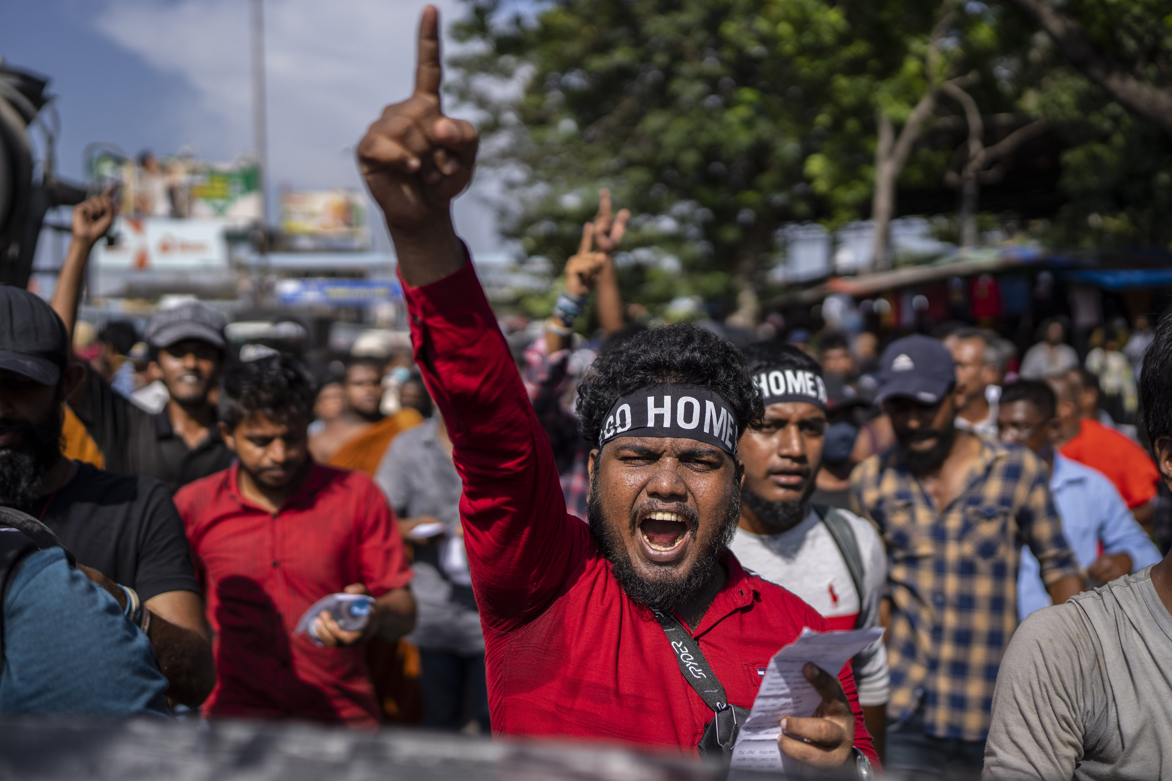 Protesters shouts slogans demanding Ranil Wickremesinghe resign on July 19, 2022. Photo: AP