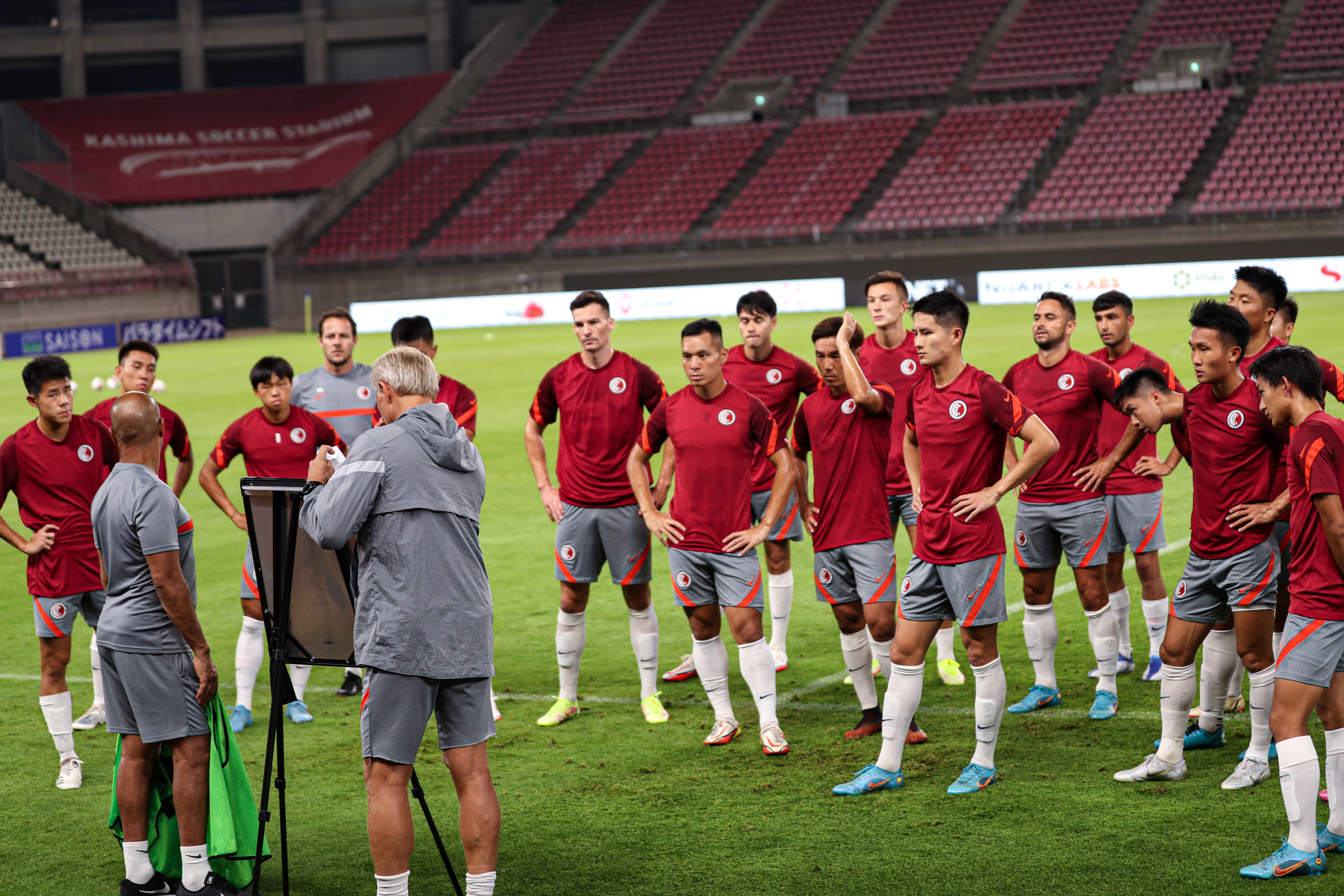 Head coach Jorn Andersen speaks to his Hong Kong players before their opening EAFF Championship game against Japan. Photo: HKFA