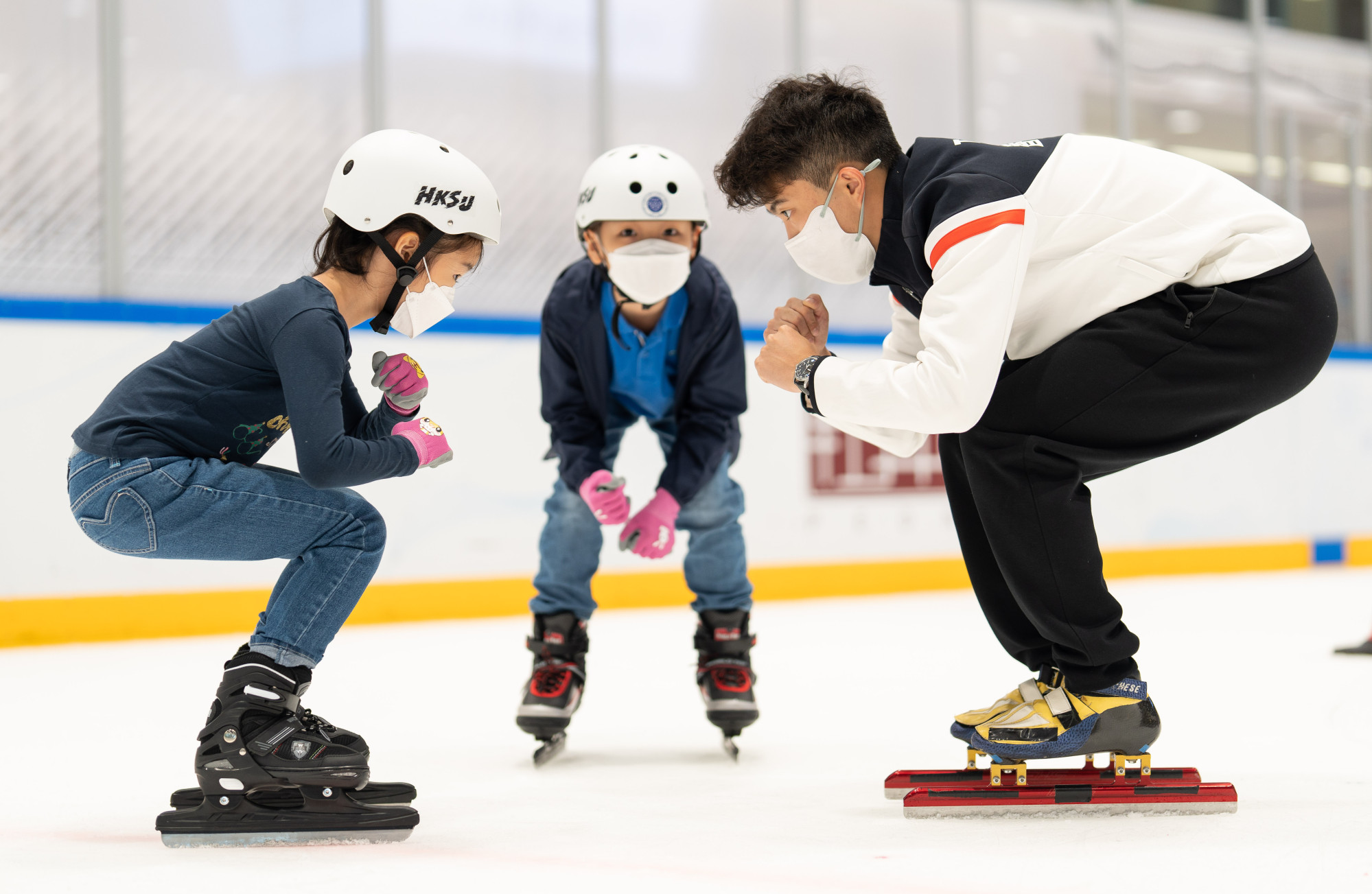 Sidney Chu teaches during a short-track speed skating programme. Photo: Handout