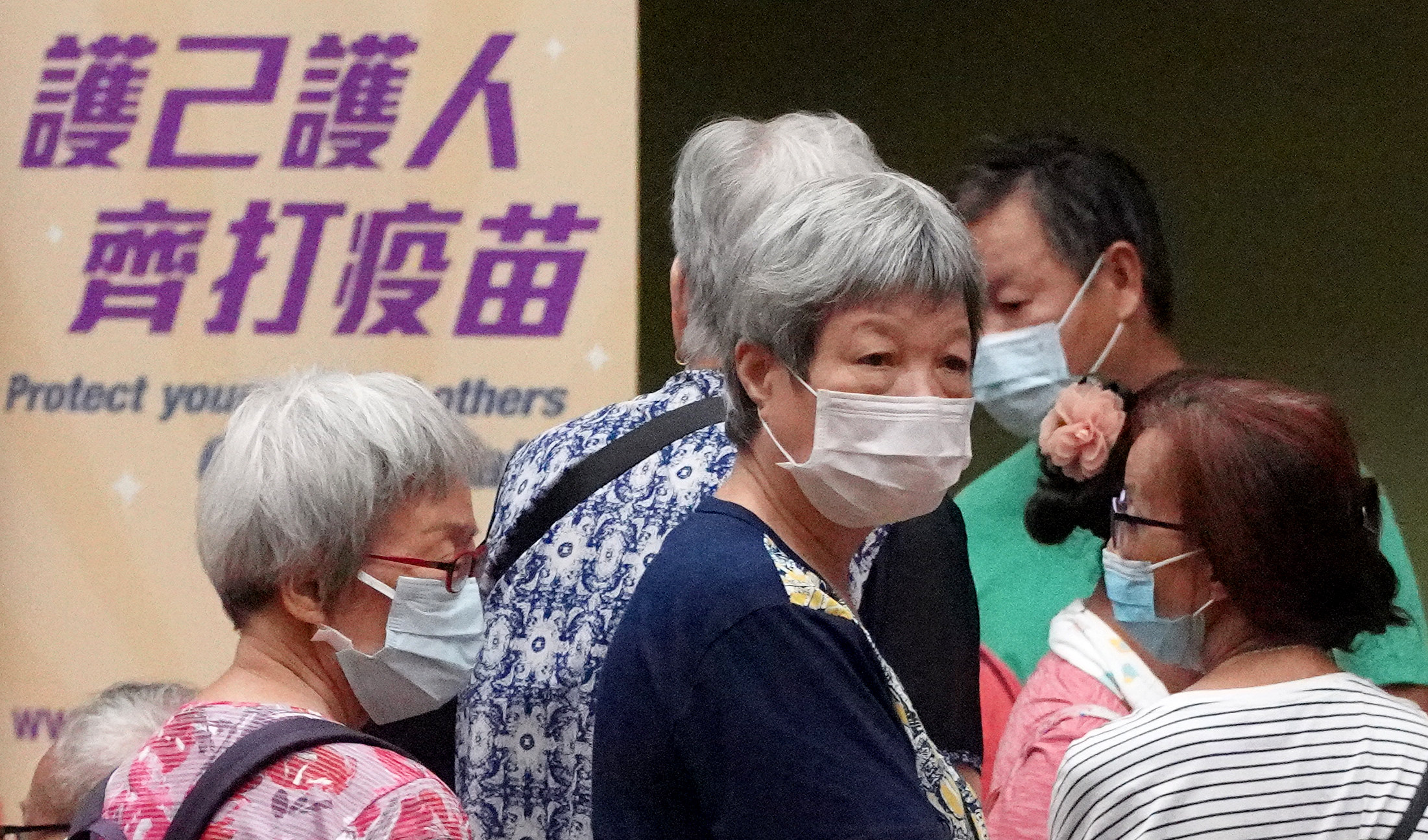 The government’s outreach vaccination team helps elderly residents at Cheung Fat Estate Community Centre in Kwai Tsing district on October 11, 2021. Photo: Winson Wong 