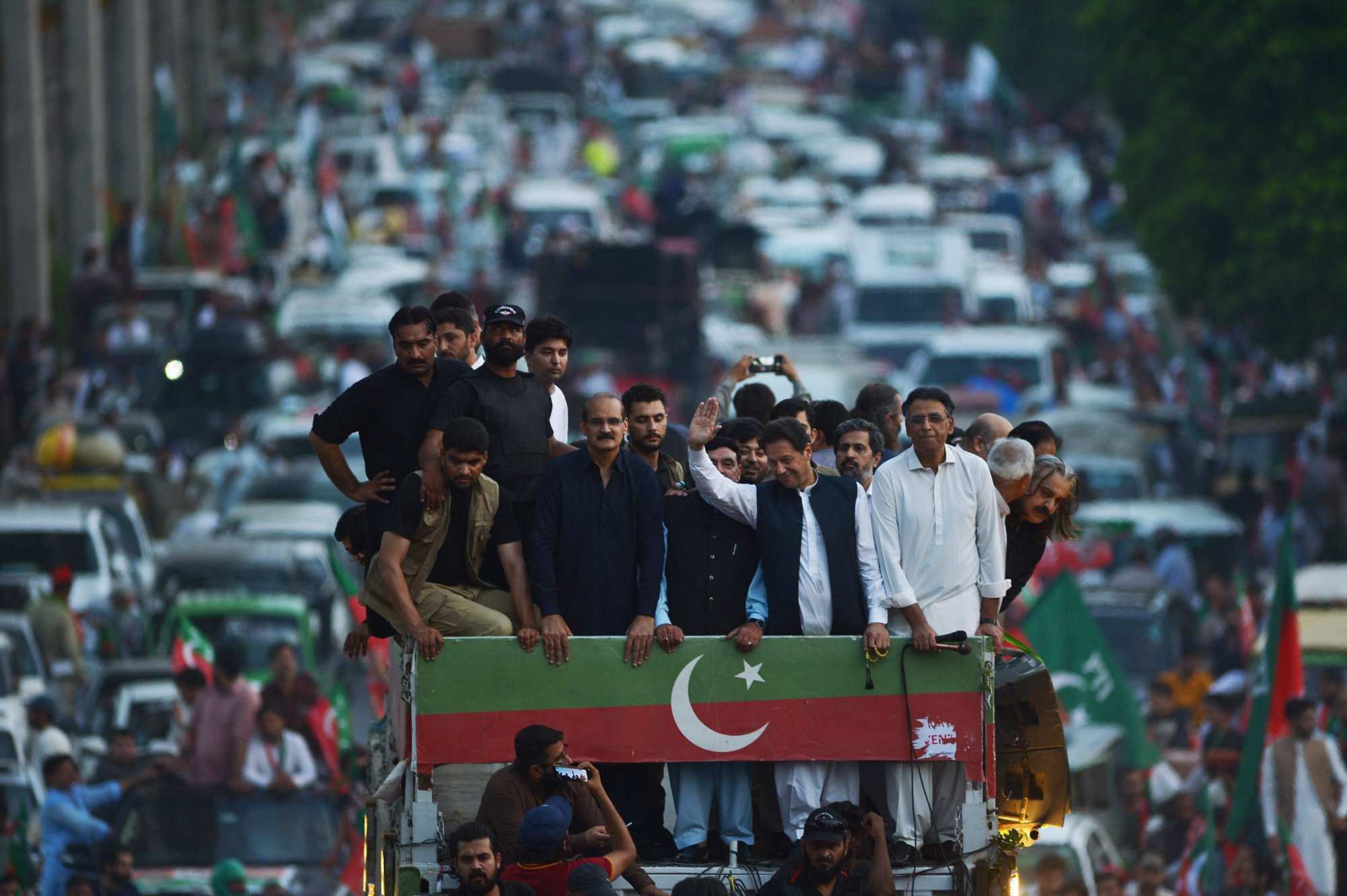 Khan gestures to supporters of his Pakistan Tehreek-e-Insaf on July 2 at a rally protesting against inflation, political destabilisation and high fuel prices. Photo: AFP
