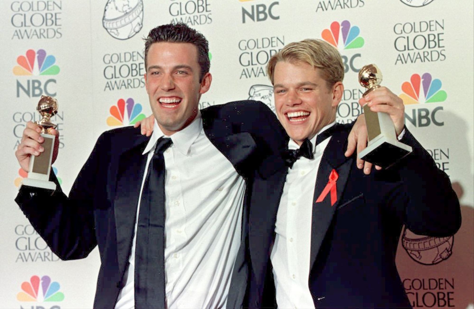 Actor Matt Damon (right) and co-writer Ben Affleck hold their Golden Globe award for best screenplay for Good Will Hunting at the 55th Annual Golden Globe Awards, in 1998. Photo: AFP Photo