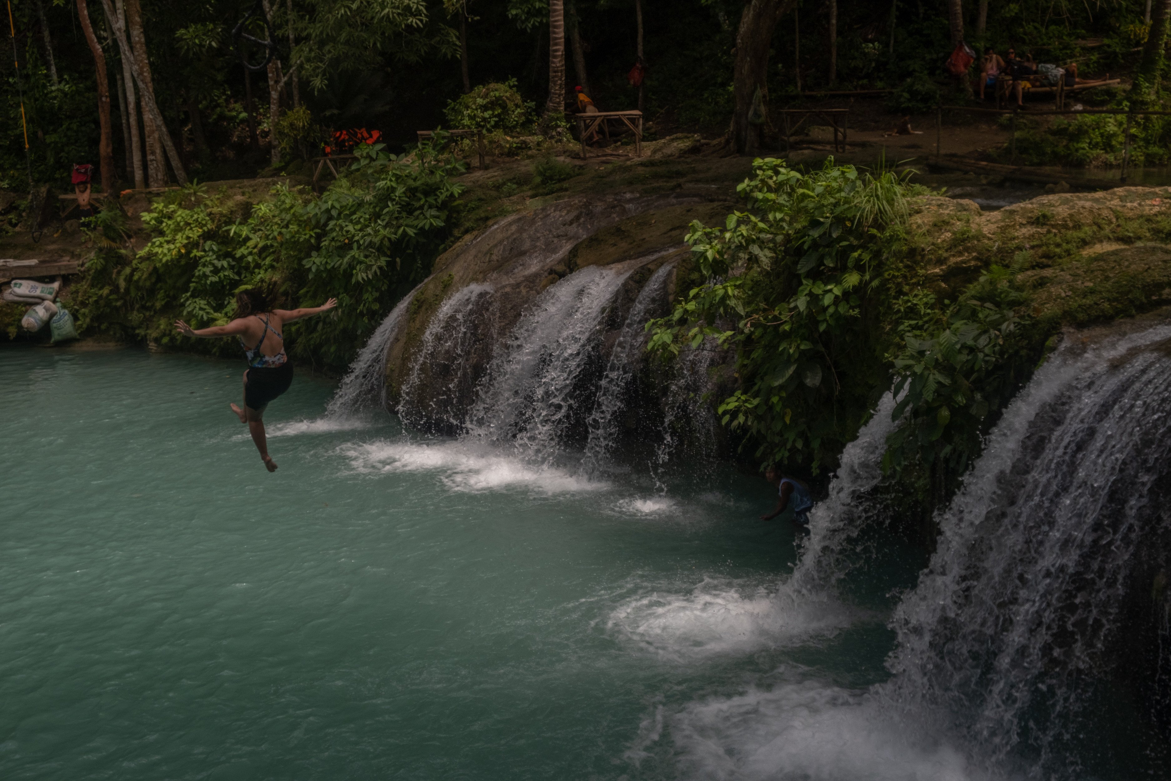 A woman jumps from the Cambugahay Falls, a popular tourist spot, in Siquijor, a Philippine Island that does not allow the use of plastics. 
Photo: Geela Garcia