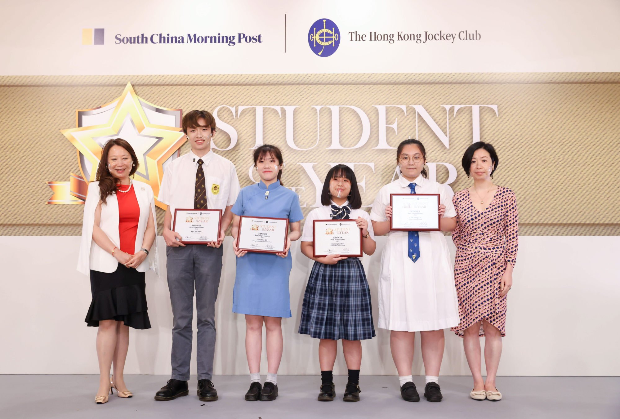 Four of the winners in the best improvement category are (from second left) Heison Cheung, Yan Tsz-soen, Tam Hoi-ki and Lam Ming-lai. Photo: Dickson Lee