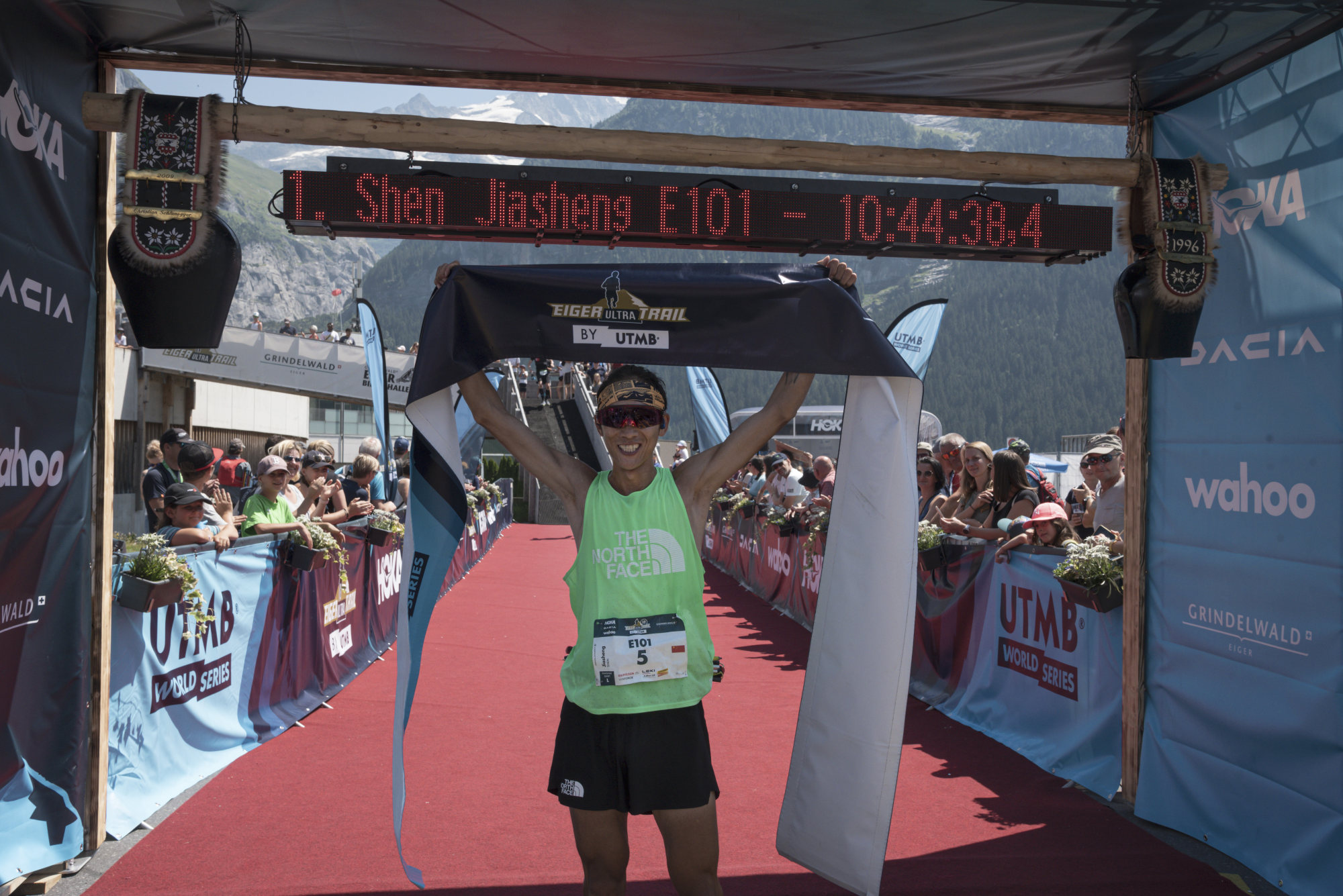 Shen Jiasheng celebrates winning the Eiger Ultra Trail in a new course record time, a week after winning a race in Switzerland. Photo: Sandrine Zurbuchen