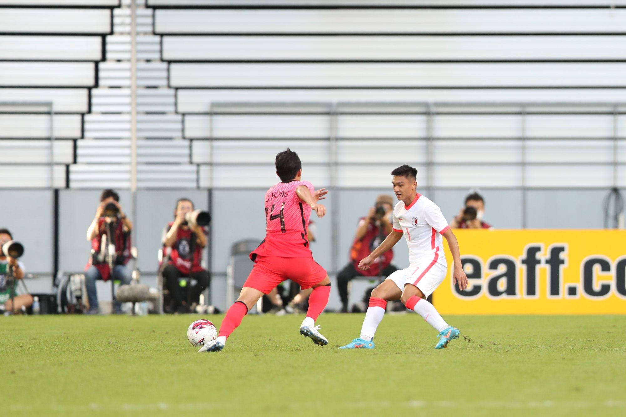 South Korea captain Hong Chul looks to take the ball past Hong Kong’s Law Tsz-chun during their East Asian Football Championship match. Photo: HKFA