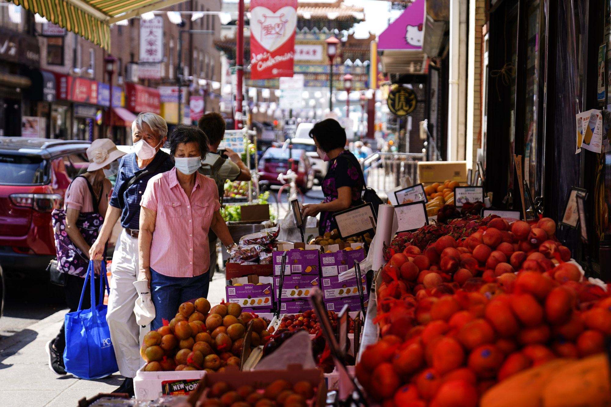 Customers shop for produce in the Chinatown neighbourhood of Philadelphia. Photo: AP