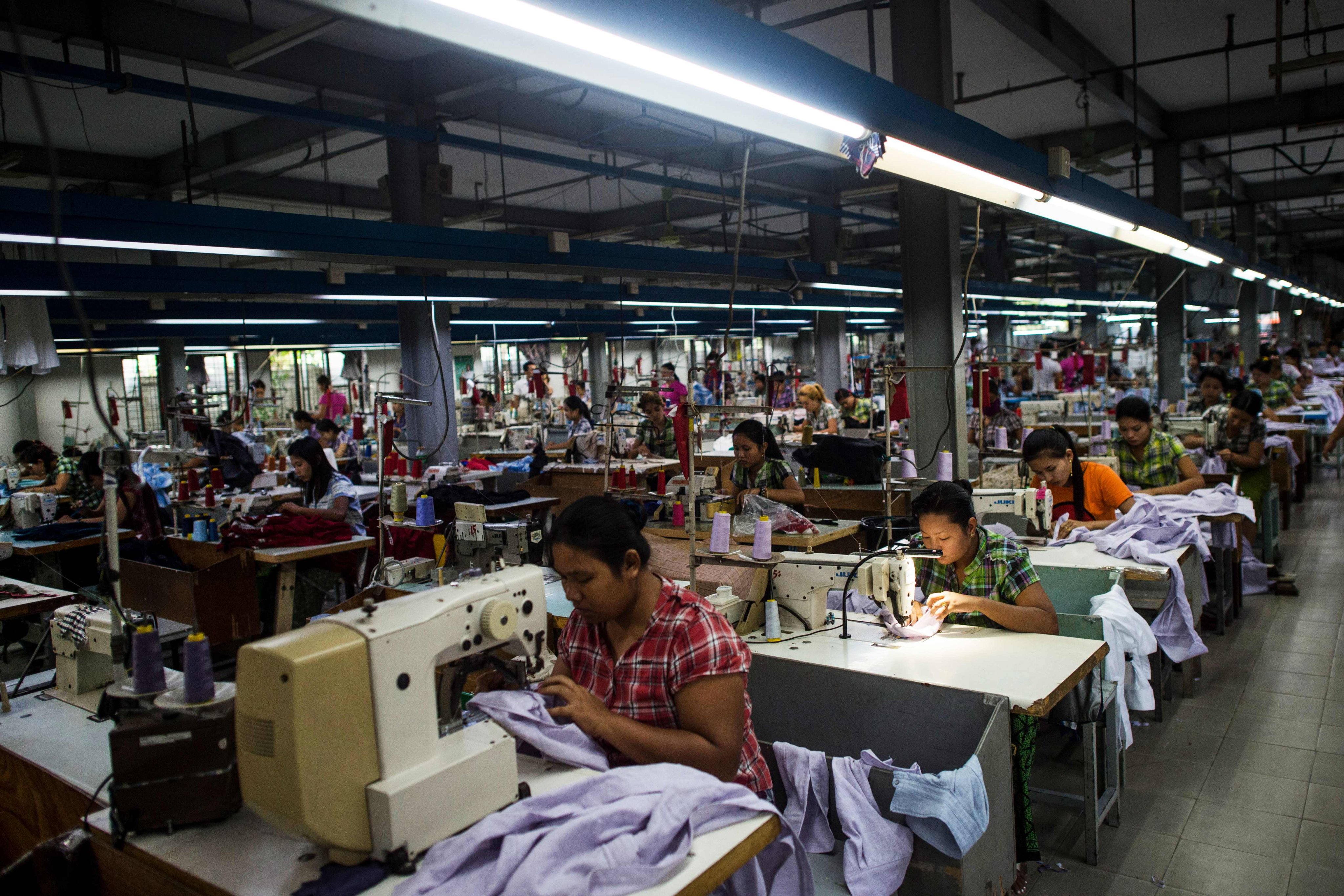 Workers work at a garment factory in Yangon. From factory floors in India to the warehouses of Cambodia, garment workers for global brands say the collapse in demand triggered by the coronavirus is being used as a cover to break their unions. File photo: AFP