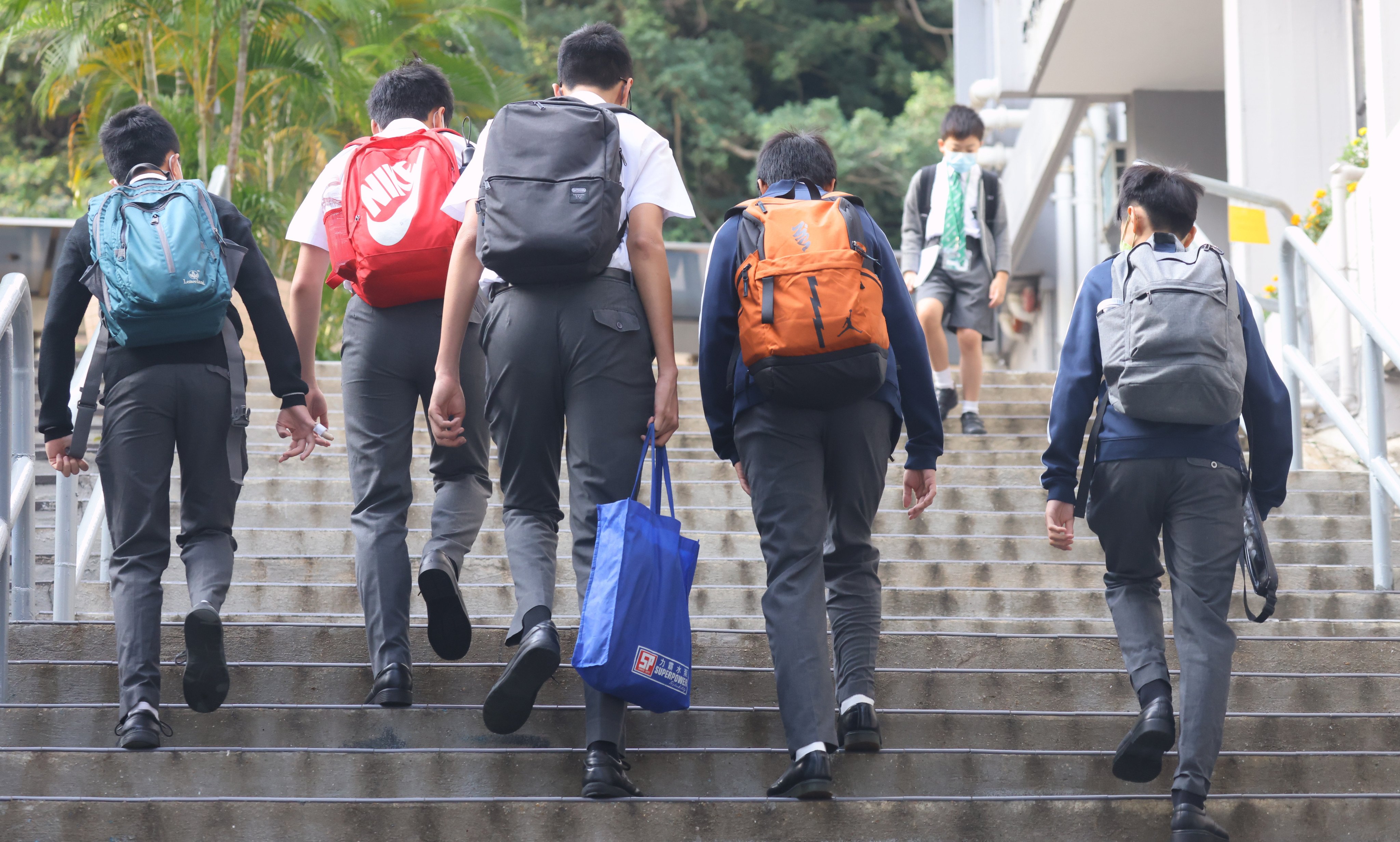 Pupils head to school in Wan Chai on May 3. Photo: Dickson Lee 