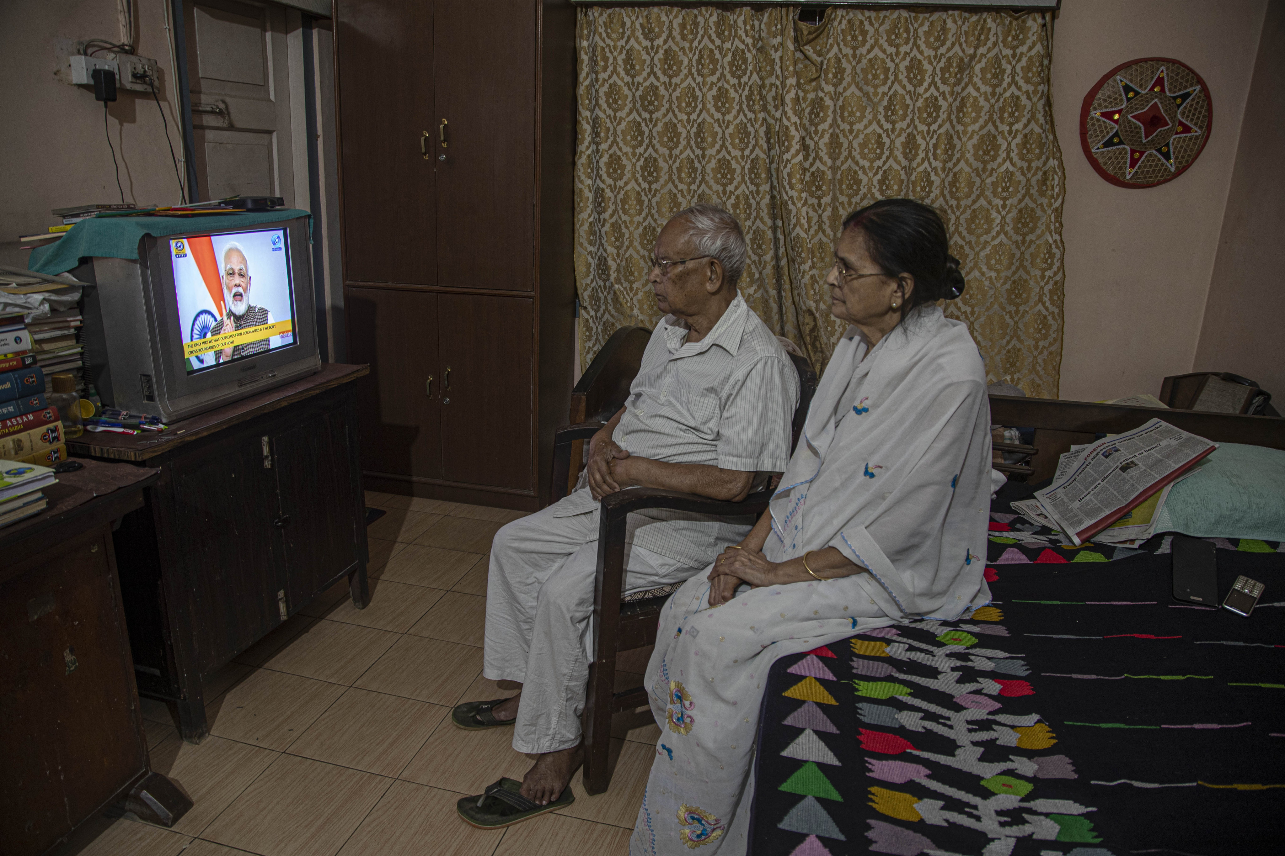 An elderly Indian couple watch TV together. Increasing numbers of older Indians are deciding to divorce after many years together. File photo: AP