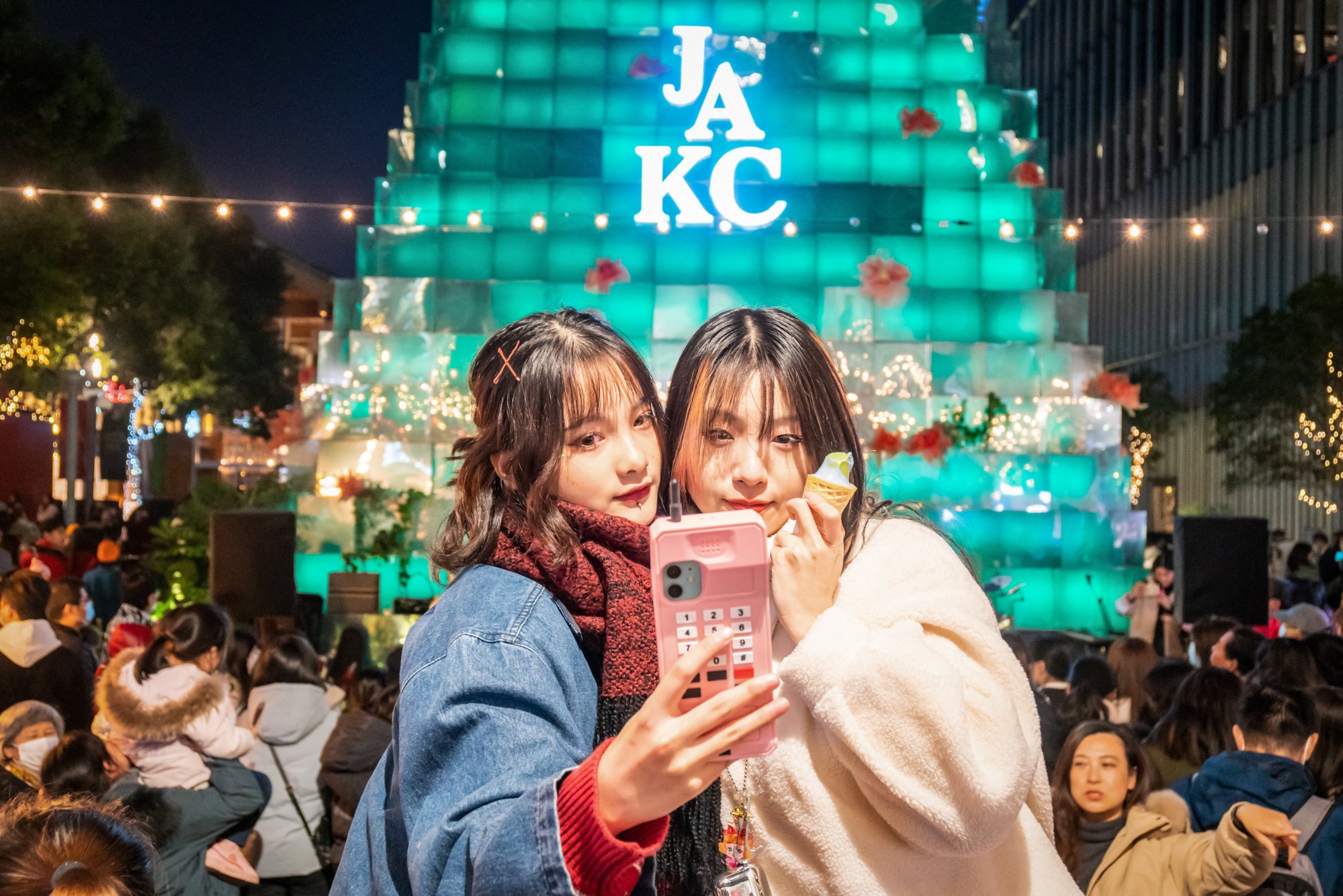 People taking a selfie outside a shopping centre in Shanghai. A legal expert says the school has no right to dictate how students use the internet outside school. Photo: AFP