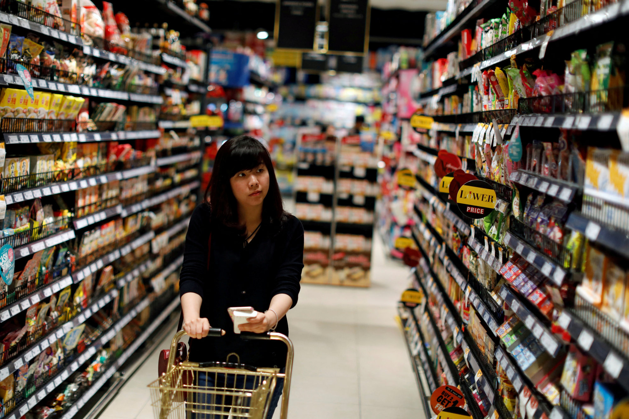 A customer at a supermarket in Bangkok. Thailand’s central bank says around half of people over 30 years old carry financial debt. File photo: Reuters