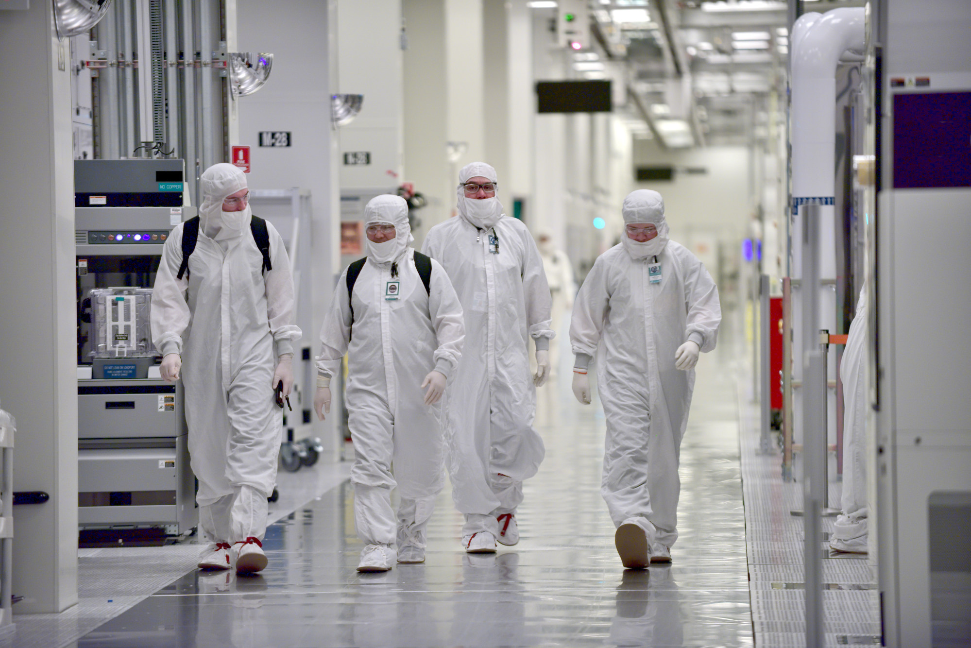 Workers wear protective dust-free suits at an Intel plant in Hillsboro, Oregon. Photo: Intel Corporation Workers wear protective dust-free suits at an Intel plant in Hillsboro, Oregon. Photo: Intel Corporation