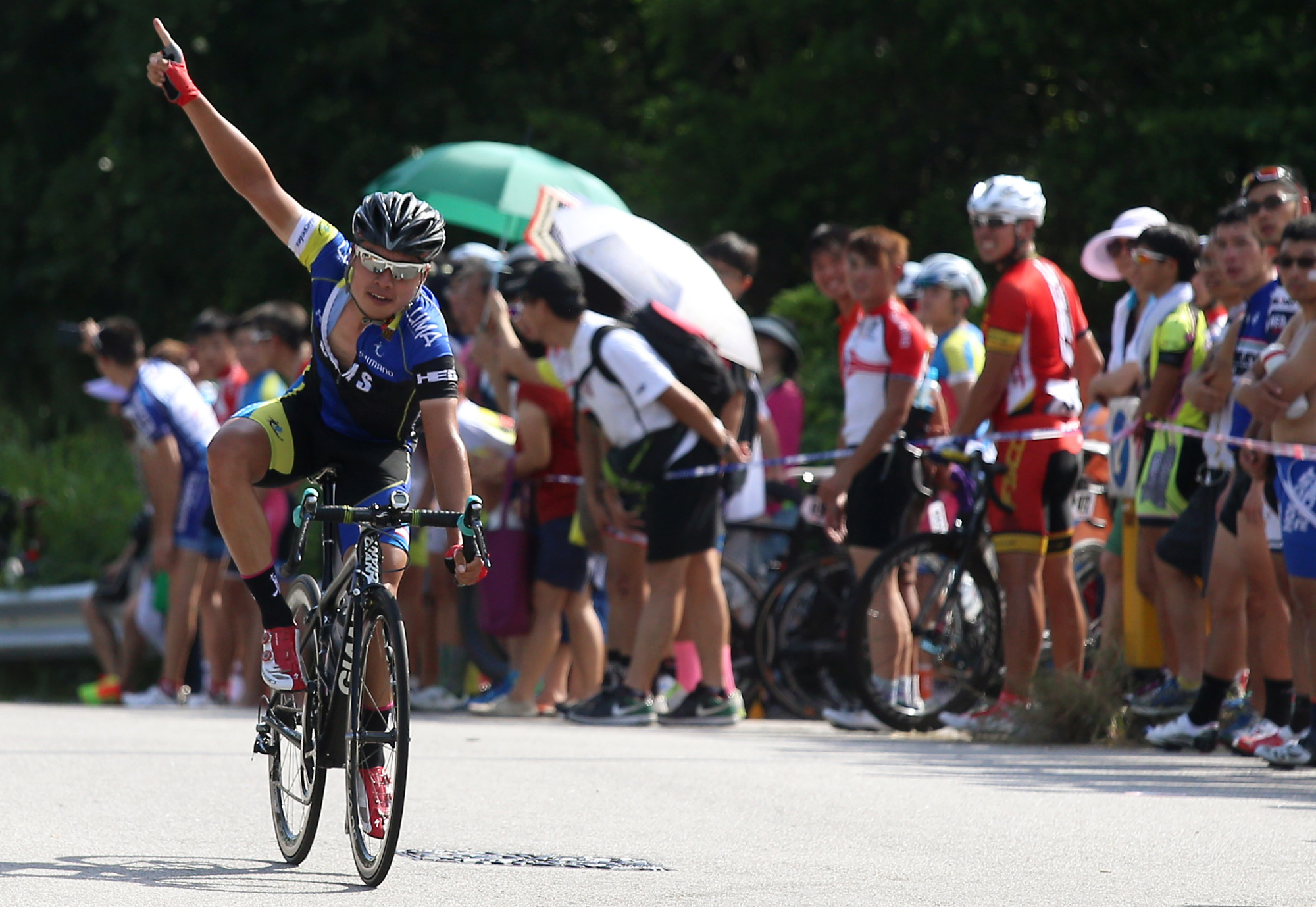 Ko Siu-wai crossing the finish line to win the 2015 Hong Kong Road Race Championships. Photo: SCMP
