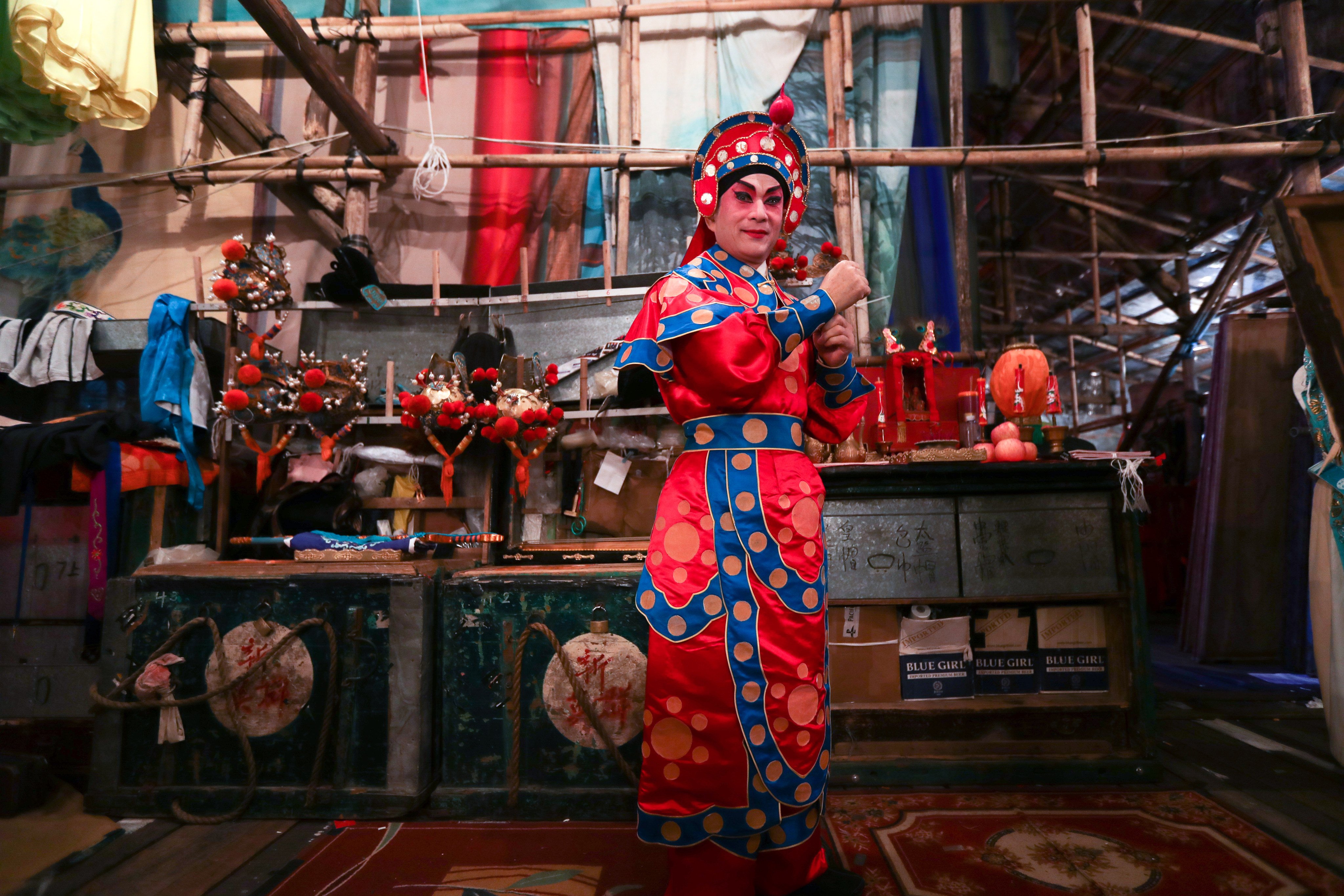An artist prepares for a Chinese opera performance backstage in a temporary bamboo theatre during a Taoist festival in Shek O on November 10, 2016. Both traditional opera and the building of bamboo theatres are listed in Hong Kong’s Intangible Cultural Heritage Database. Photo: Nora Tam 