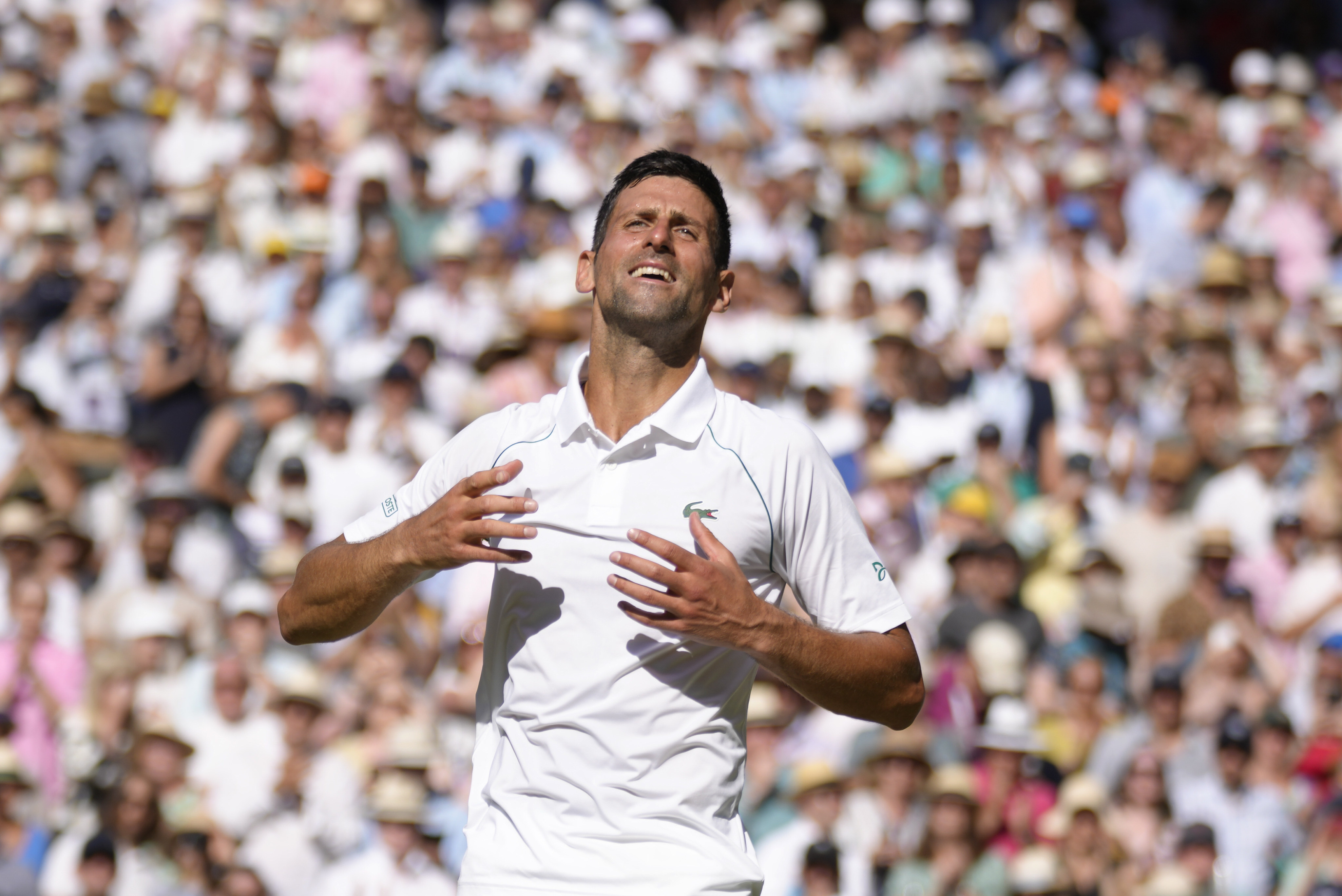 Novak Djokovic celebrates after beating Nick Kyrgios in their men’s singles final at Wimbledon, UK on July 10. Photo: AP