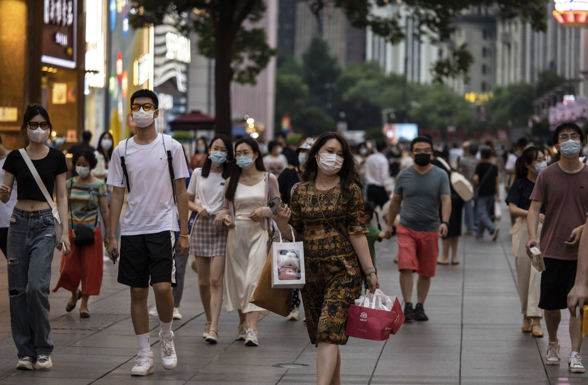 Nanjing Road, Shanghai’s popular shopping street, is filled with people on July 9. Photo: Bloomberg.