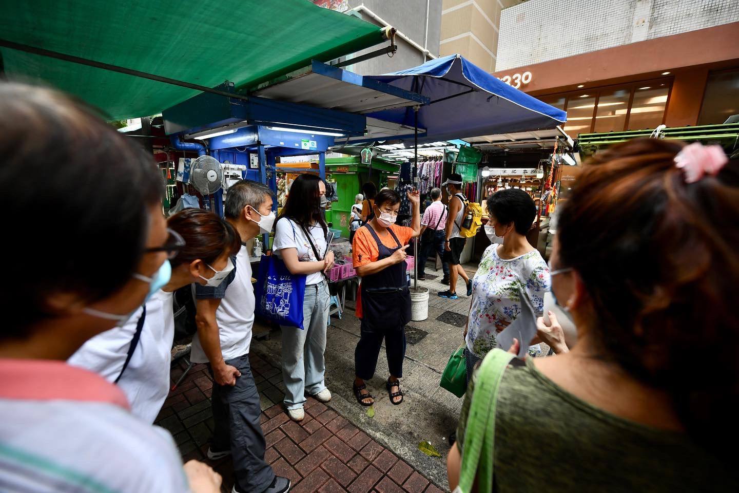 A crowd of people standing in the Wan Chai hawker stall strip. Photo: Come’n Chill at Wanchai