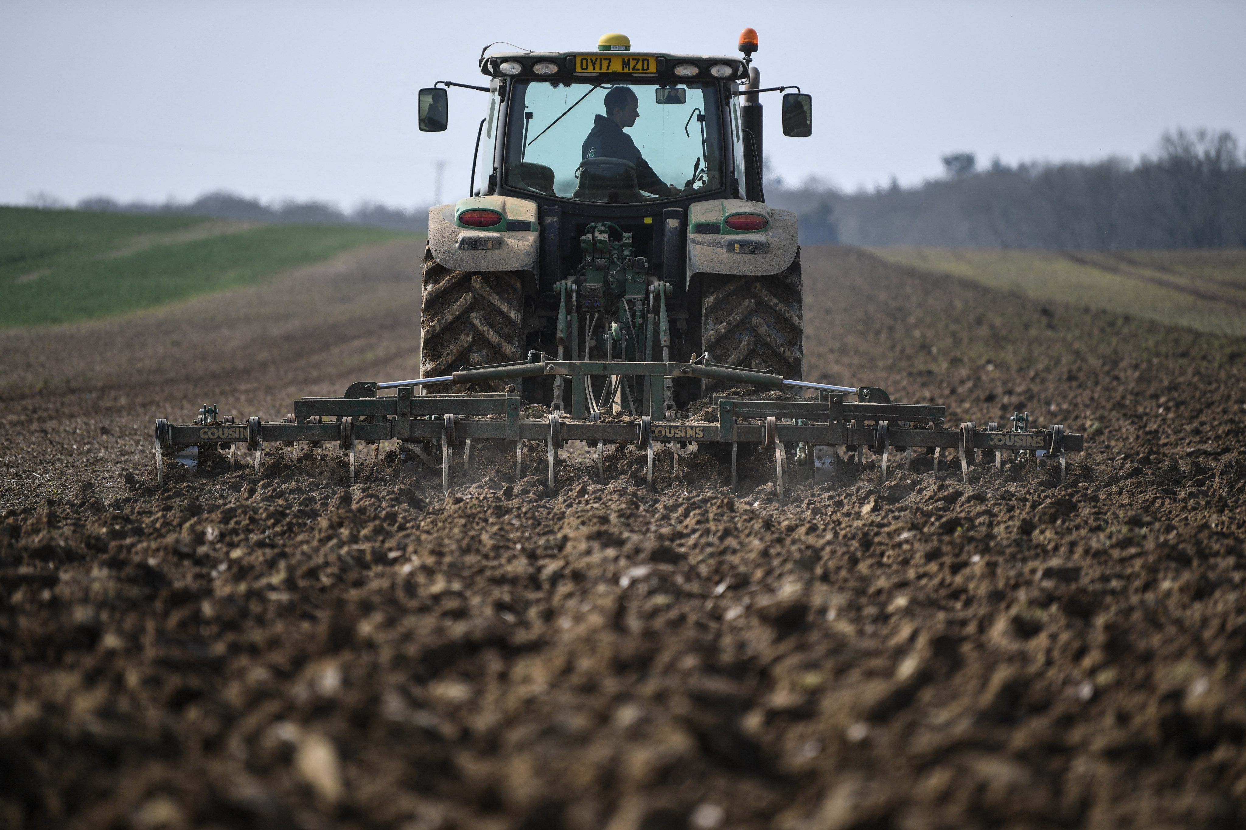 A tractor prepares farmland in England for sowing crops. Environmental activist George Monbiot says our current, large-scale, tillage farms – fuelled by fertiliser overkill – are killing soil fertility and aren’t the solution to feeding the world’s growing population. Photo: AFP