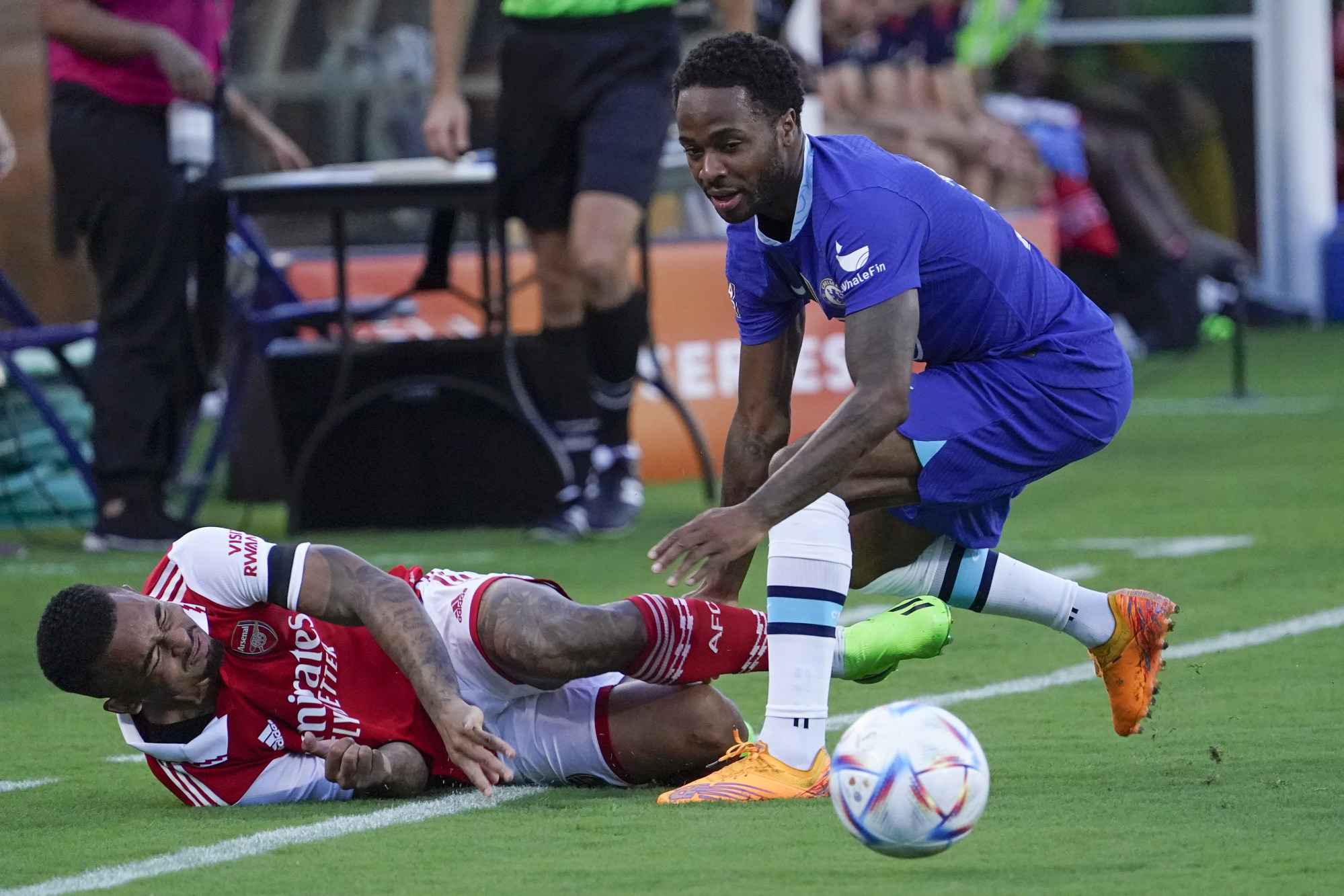 Arsenal’s Gabriel Jesus (left) falls while going for the ball against Chelsea’s Raheem Sterling during the first half of a Florida Cup friendly in Orlando, Florida. Photo: AP