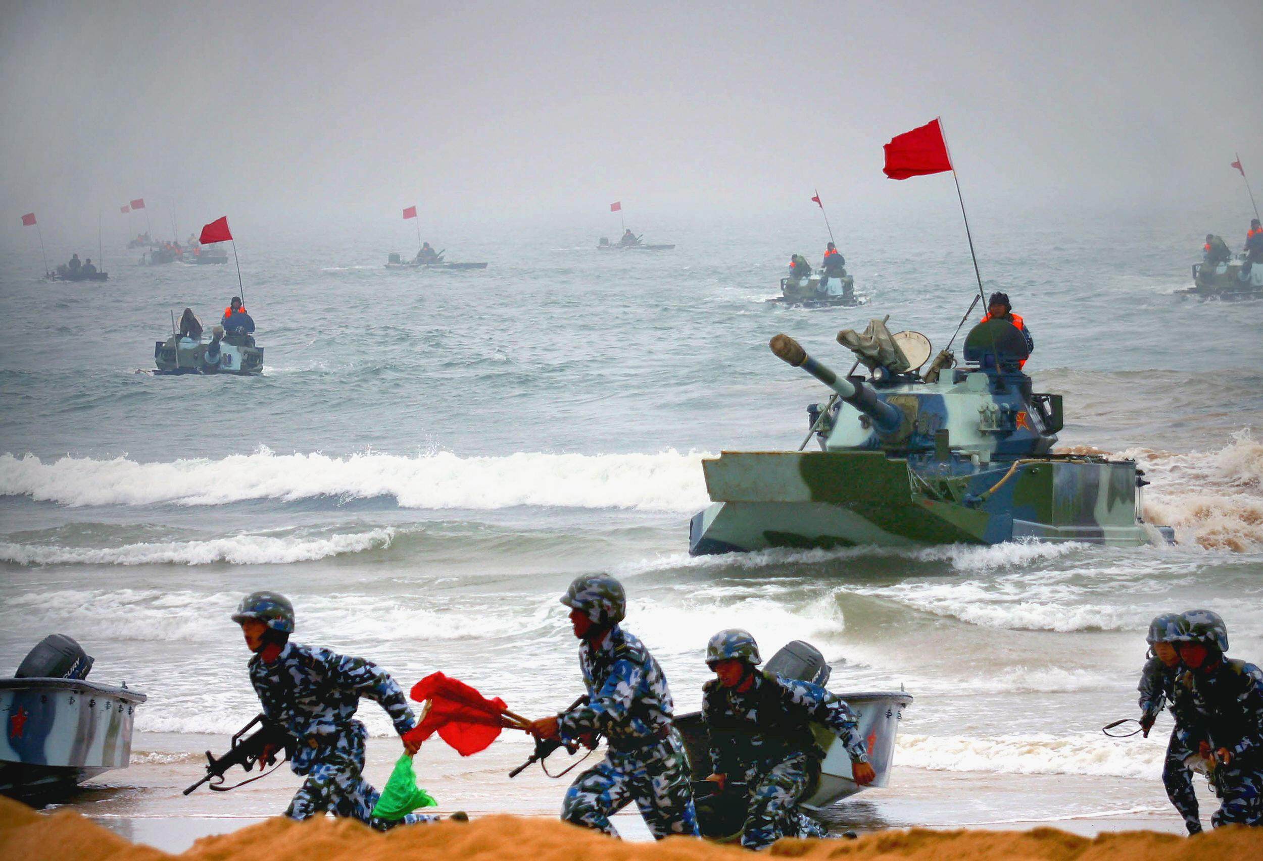 Chinese amphibious tanks and marines storm a beach during a joint military exercise with Russia in Shandong province in 2005. Photo: AFP