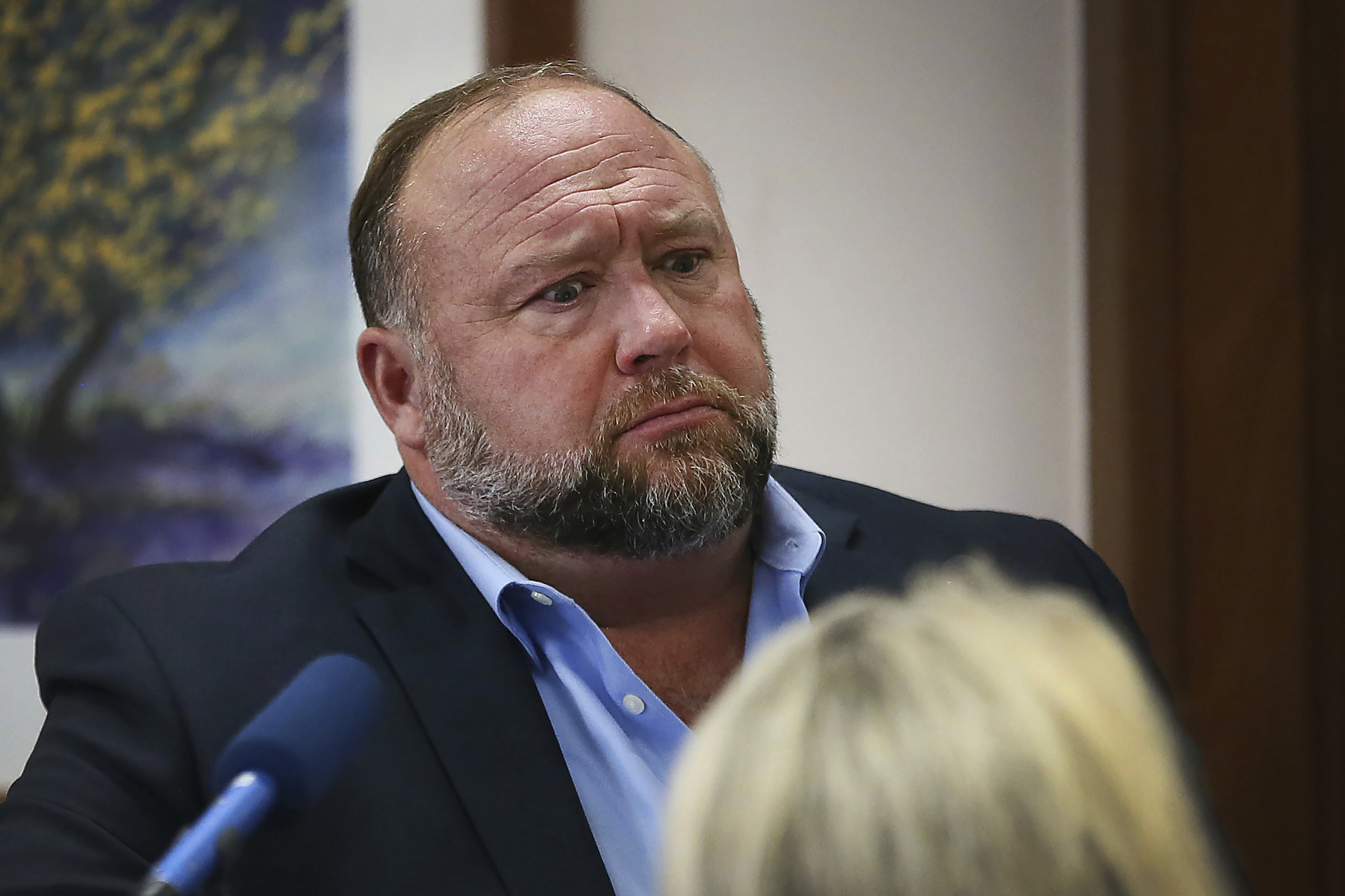 Conspiracy theorist Alex Jones attempts to answer questions about his emails during trial at the Travis County Courthouse in Austin, Texas, on Wednesday. Photo: Austin American-Statesman via AP