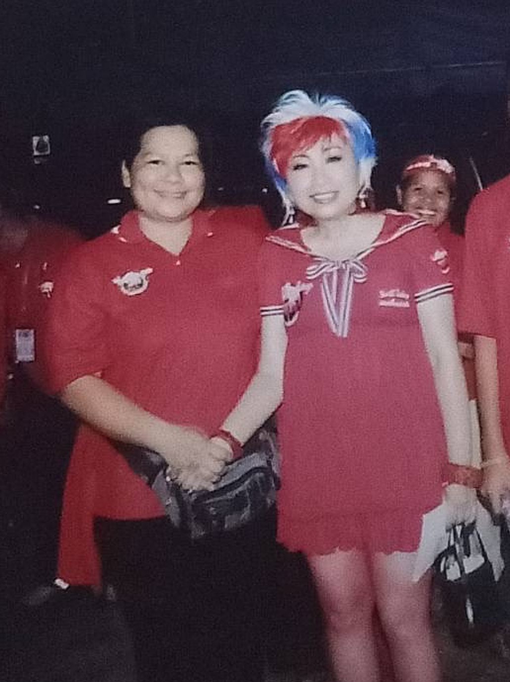 Red-shirt Rattawee Puiprom (left) at a rally in Bangkok in 2009. Handout