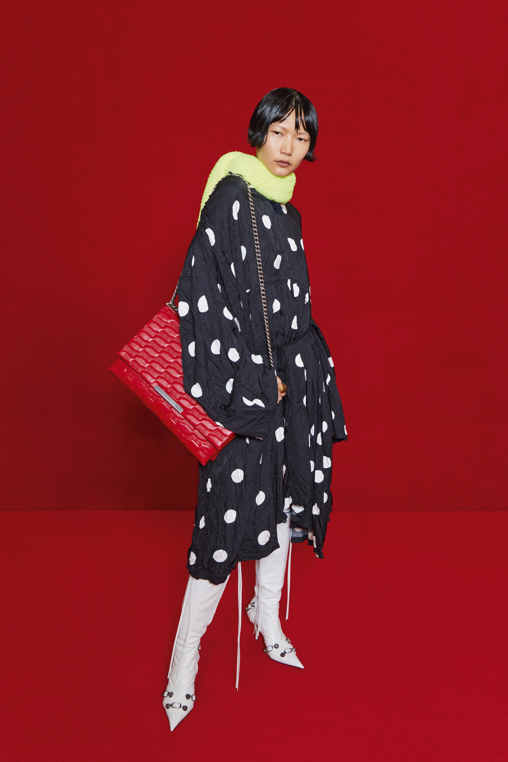 Balenciaga’s midi black dress with white polka dots.