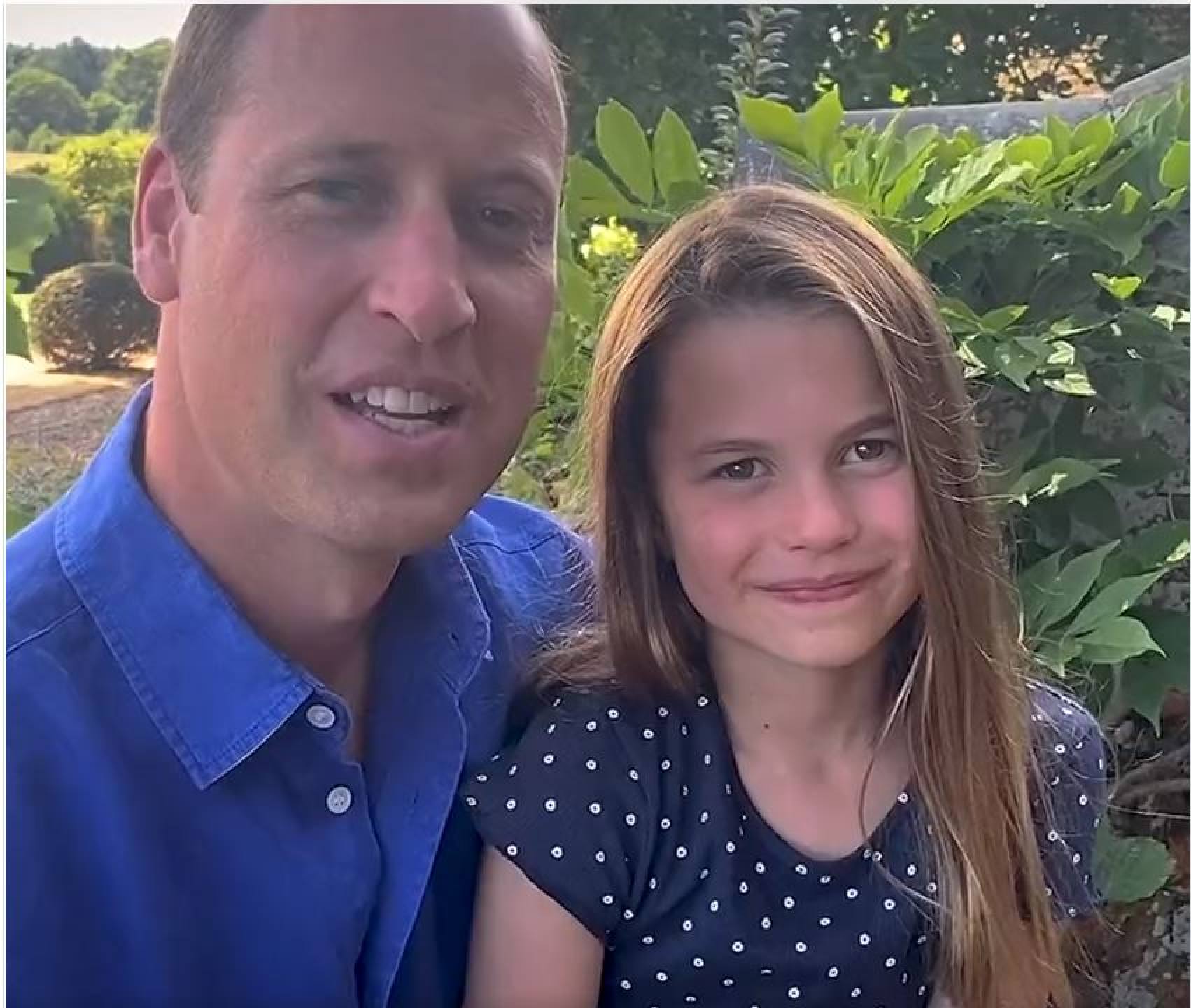 Princess Charlotte in a polka dot top in a video with her dad, Prince William. Photo: Twitter