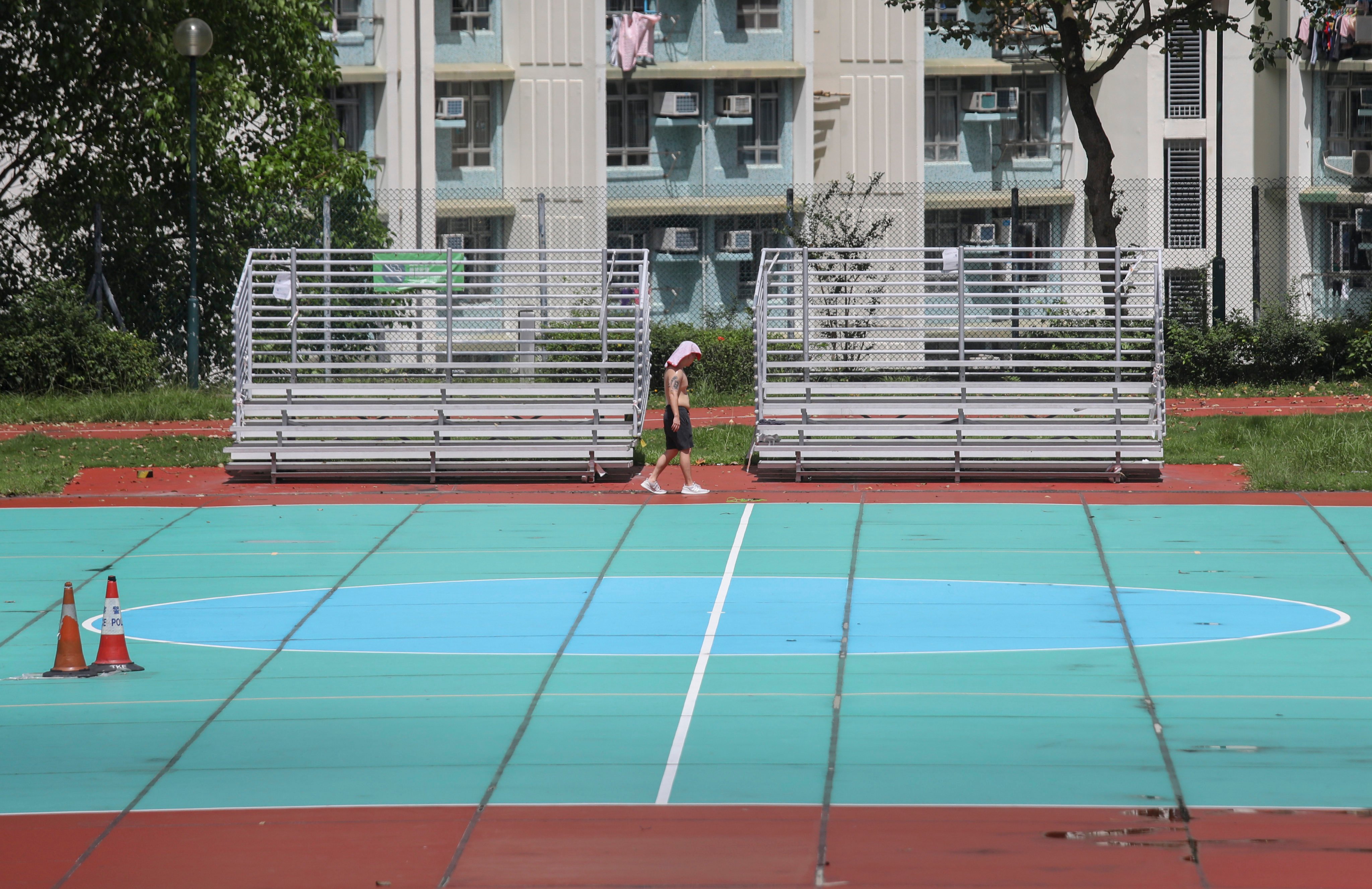 The sun beats down on a man exercising at a sports ground in Lam Tin on July 8. Photo: Xiaomei Chen