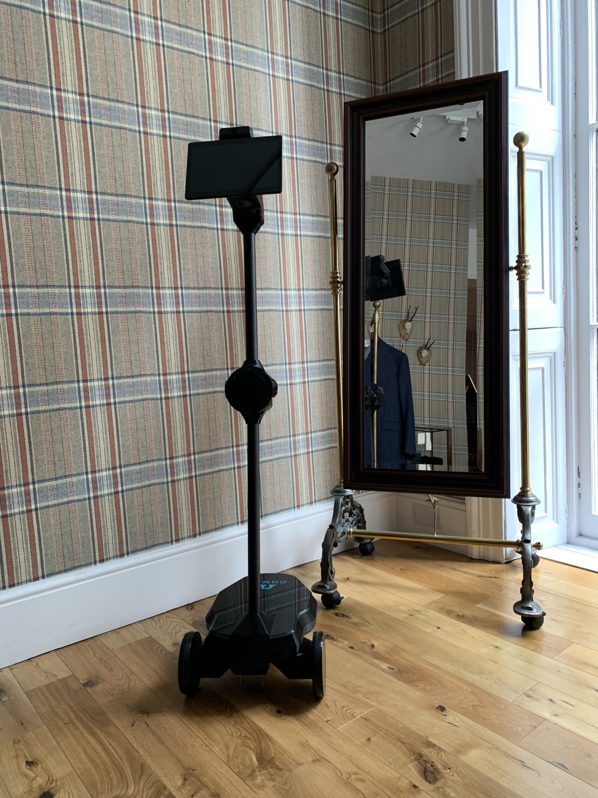 Huntsman’s robot enables tailors to fit suits remotely all over the world. Photo: Huntsman