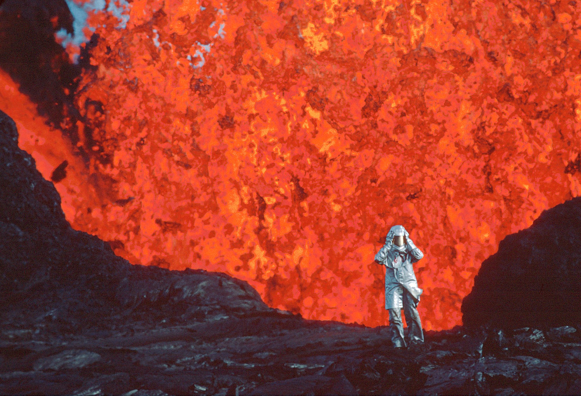 Katia Krafft standing near a lava burst at Krafla Volcano, Iceland, in a still from Fire of Love. Photo: Image Est