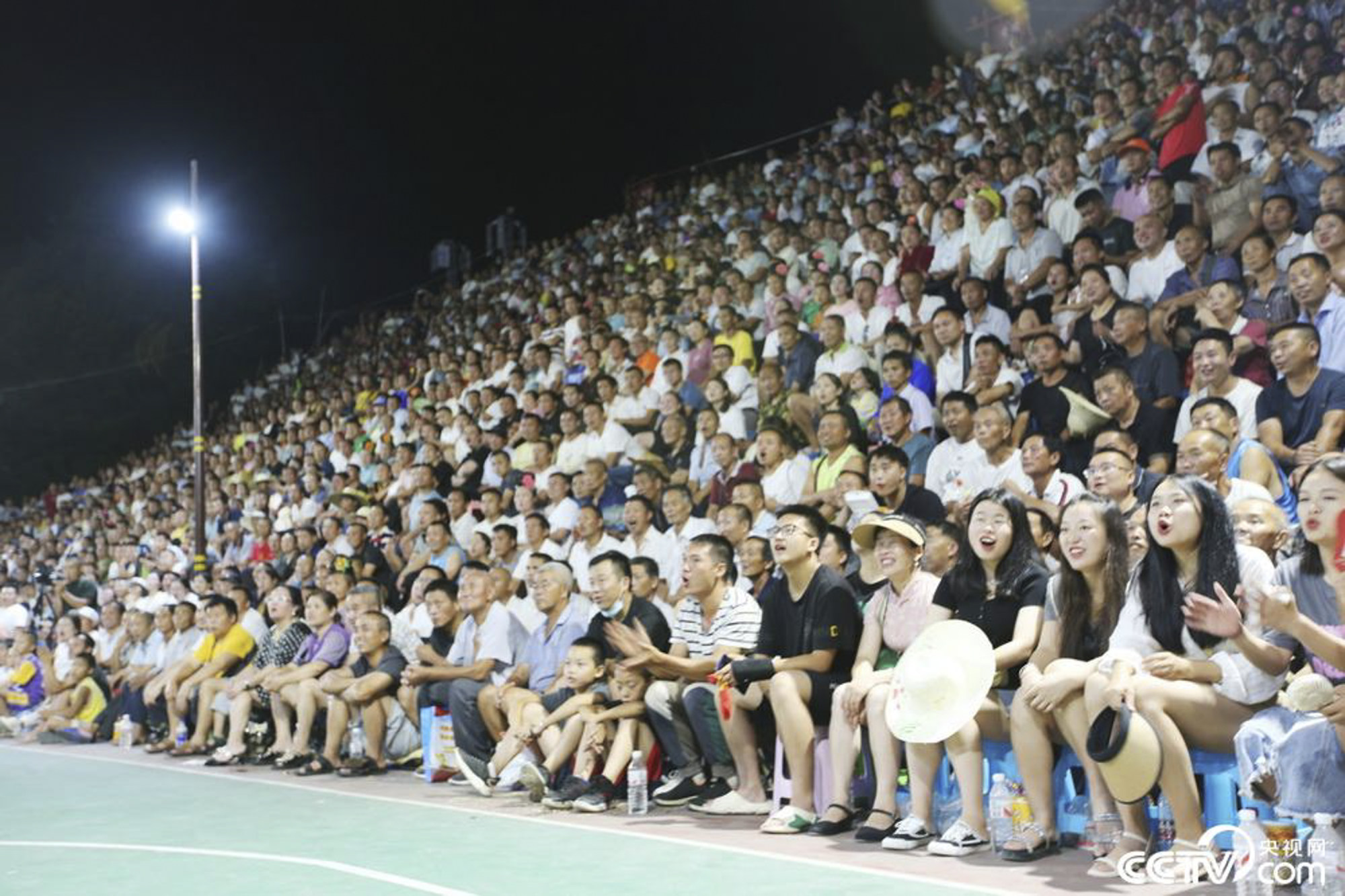 Crowds often will gather on nearby hills and rooftops when the spectator areas are filled. Photo: CCTV