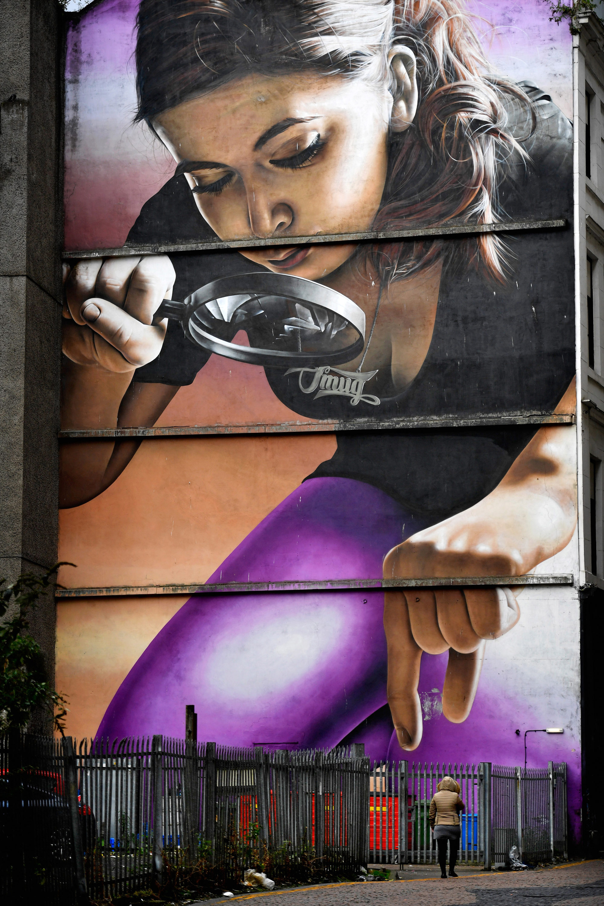 Honey, I Shrunk the Kids, by street artist Smug, covers the side of a building on Mitchell Street in Glasgow. Photo: Getty Images