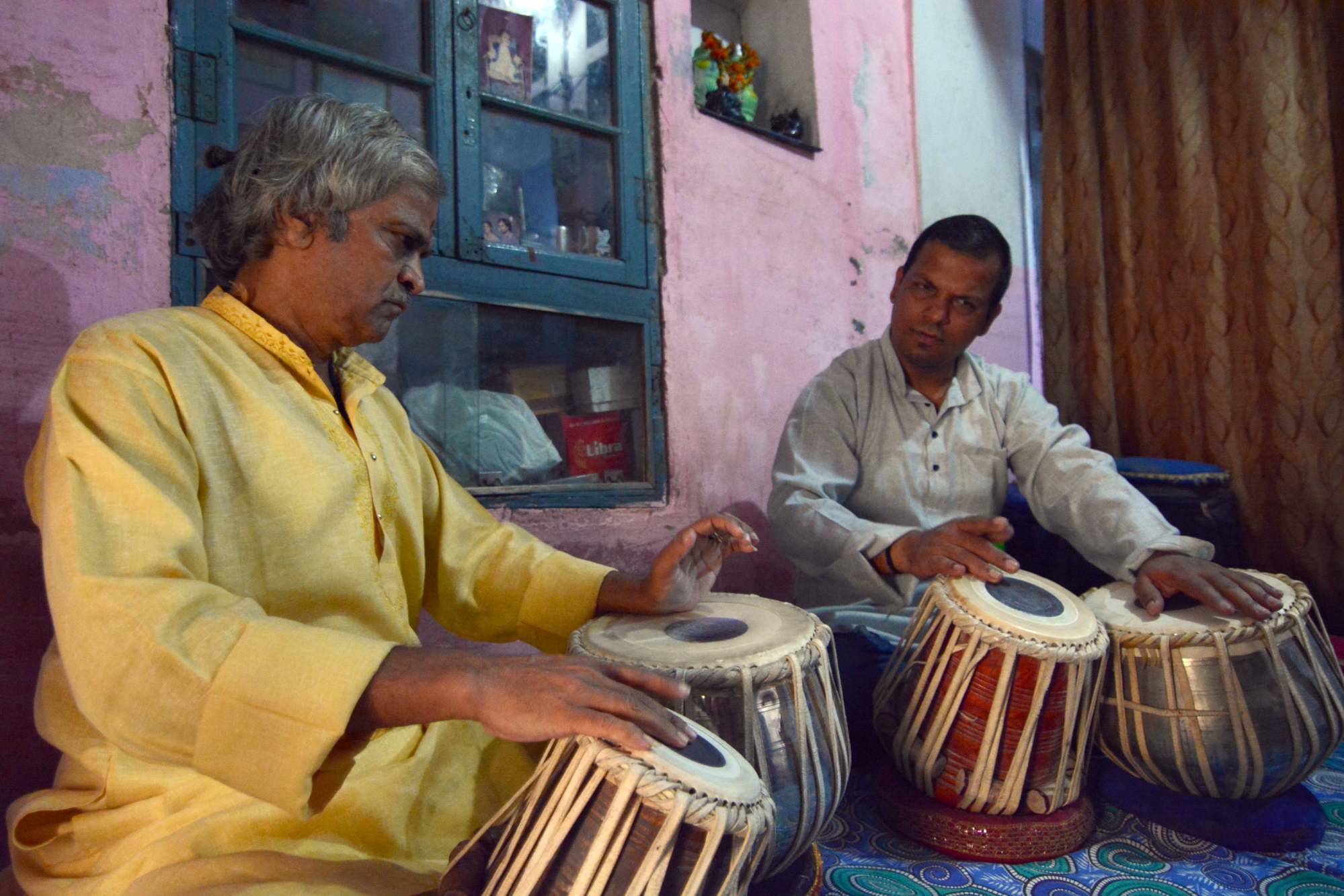 Pandit Kishenram Dohkar with student Ravi Tripathi, playing on tabla made by Mumtaz Bhai. Photo: Irfan Nabi