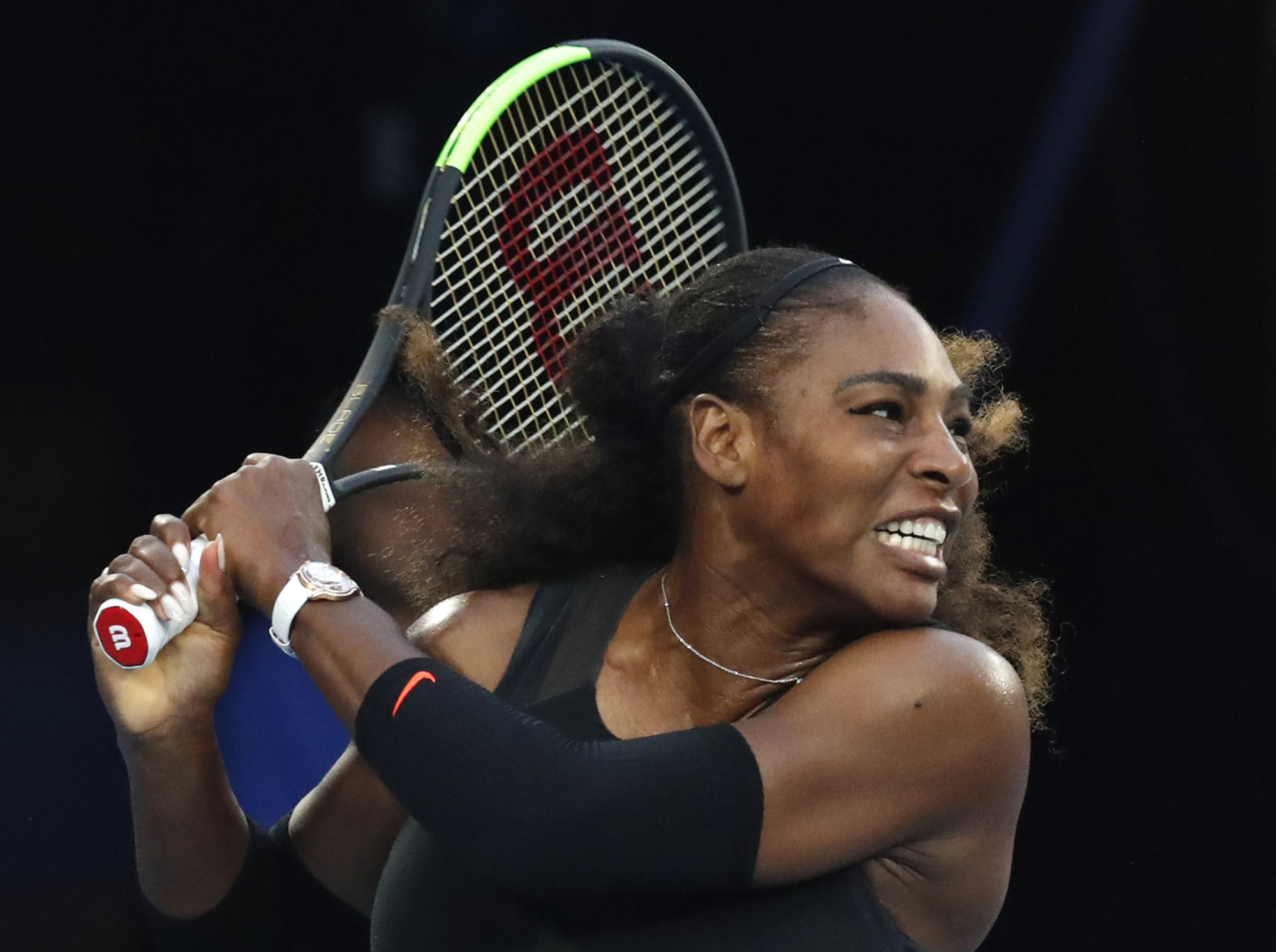 Serena Williams follows through on a backhand return to her sister Venus during the women’s singles final at the Australian Open tennis tournament in Melbourne, Australia, in January 2017. Photo: AP Photo