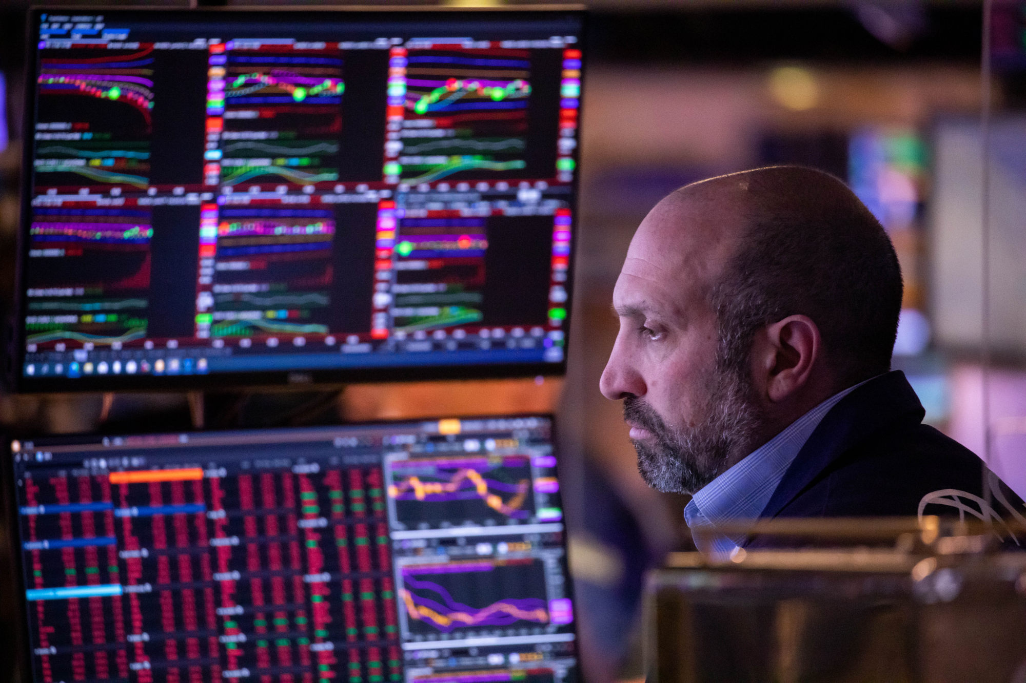 A trader monitors stocks on the New York Stock Exchange. An increasing number of mainland Chinese companies risk being kicked off US exchanges as the SEC ratchets up pressure. Photo: Xinhua