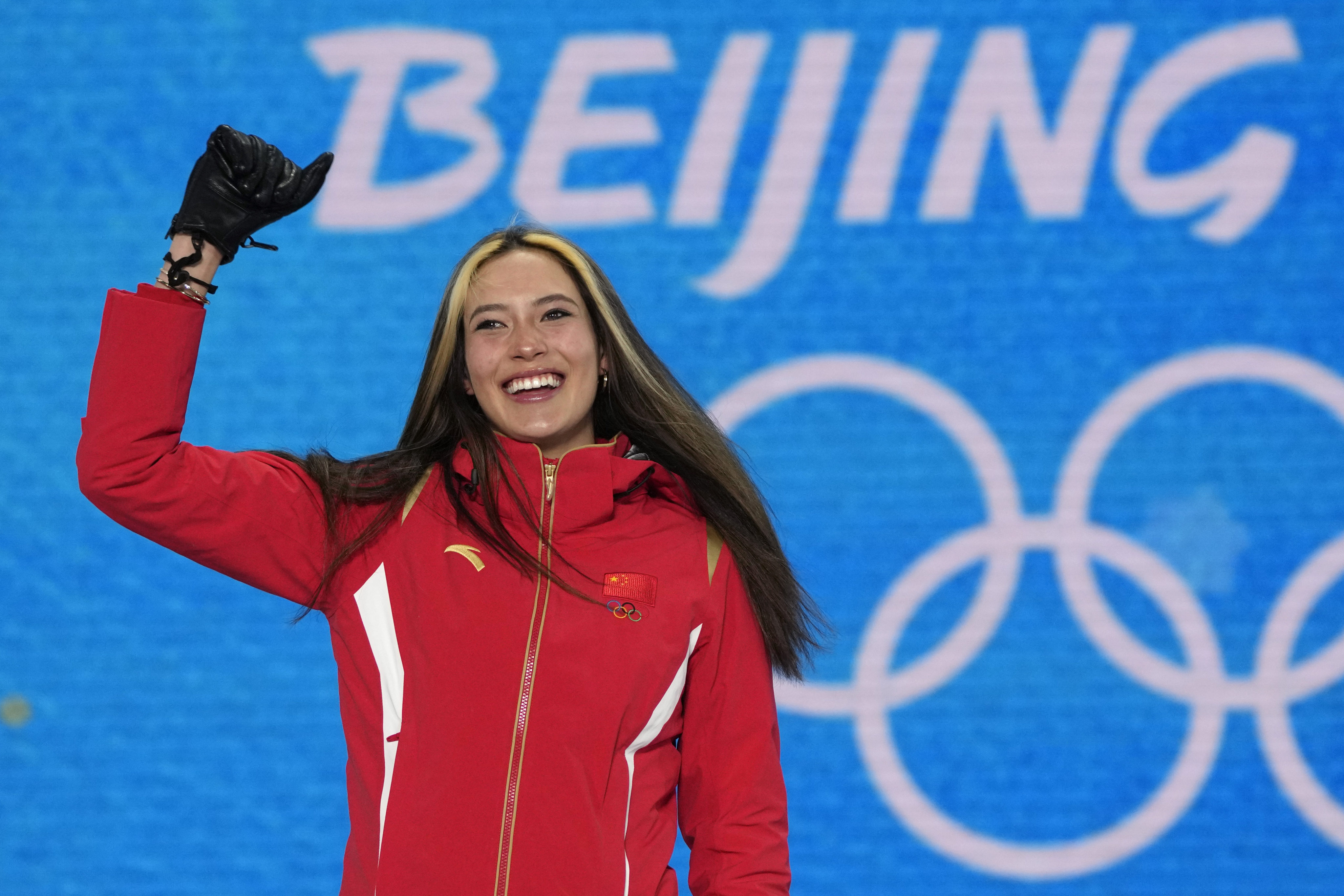 Eileen Gu celebrates during a medal ceremony for the women’s freestyle skiing halfpipe competition at the 2022 Winter Olympics on February 18 in Zhangjiakou, China. US-born Gu competed for China. Photo: AP 